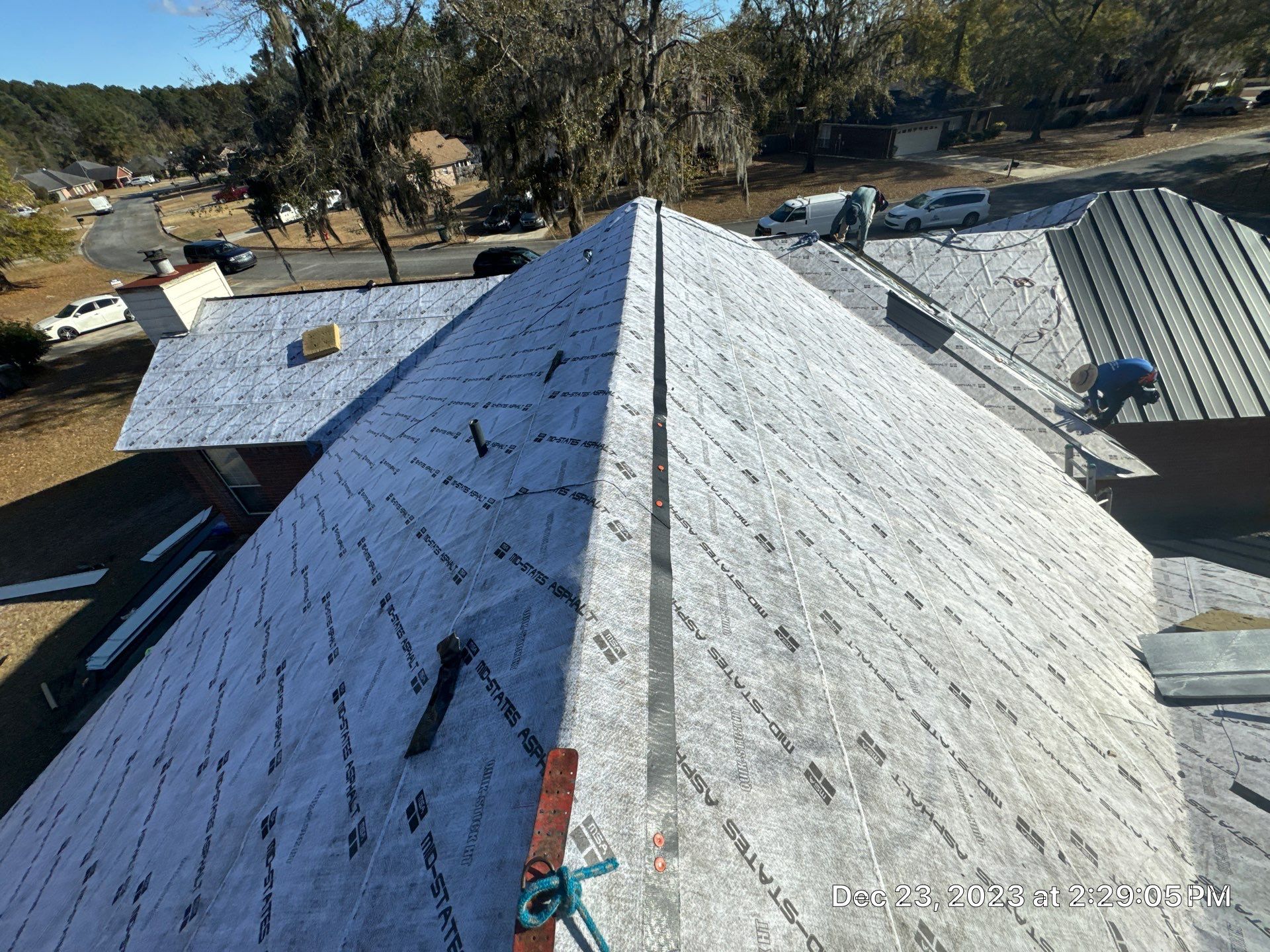 Residential Roofing Installation using Benton 26Ga 1inc Snapcock Metal Roof KYNAR Matte Black by Talya Roofing