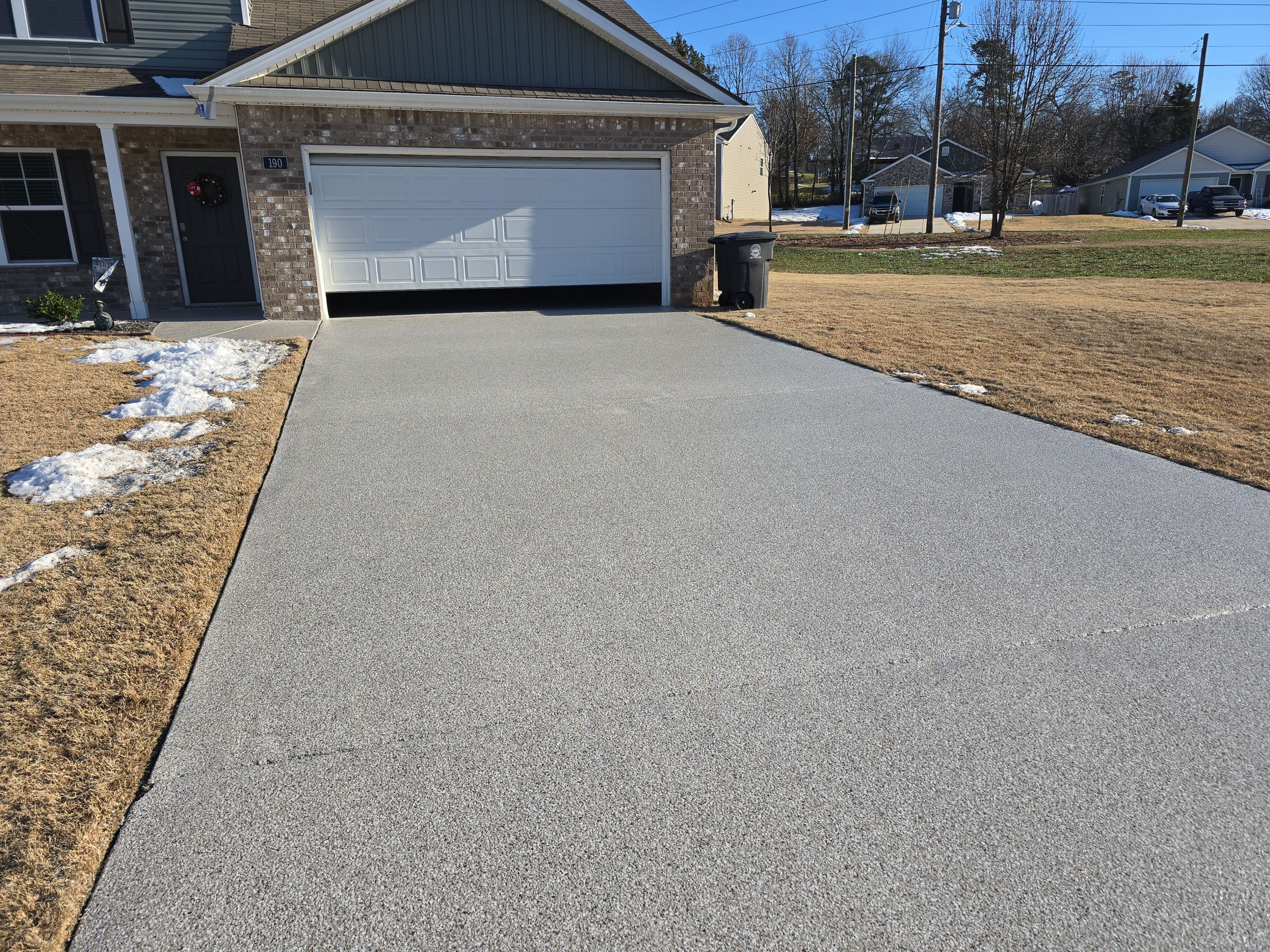 Driveway, Garage, & Front Porch using Creekbed by Elite Floor Solutions