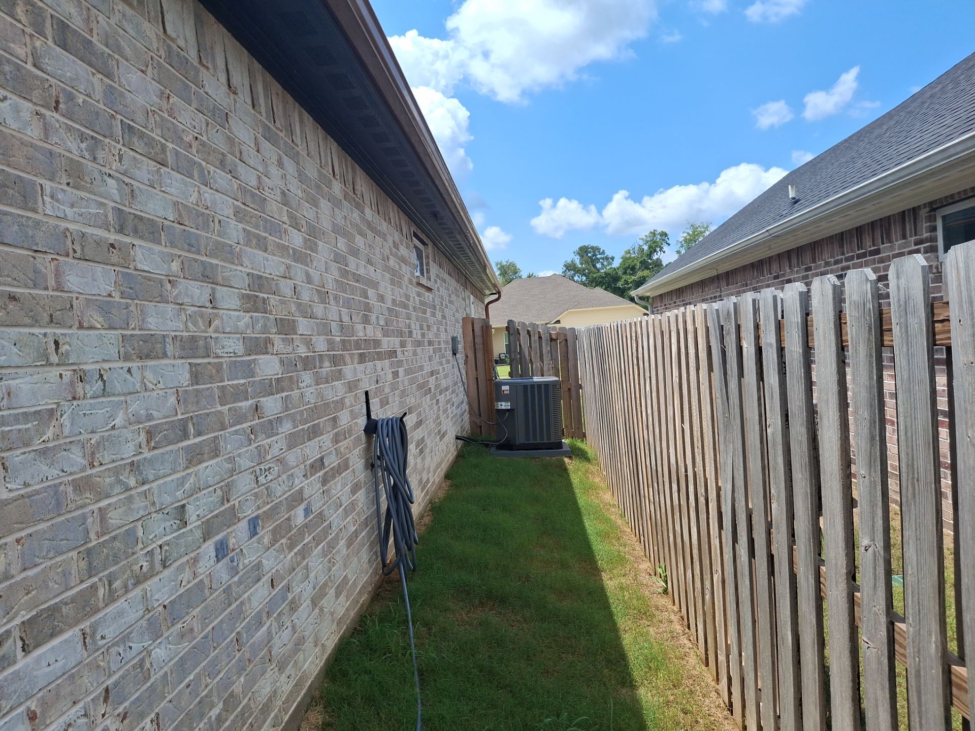 Touching Up a Fence in Whitehouse by Quality Coats Painting