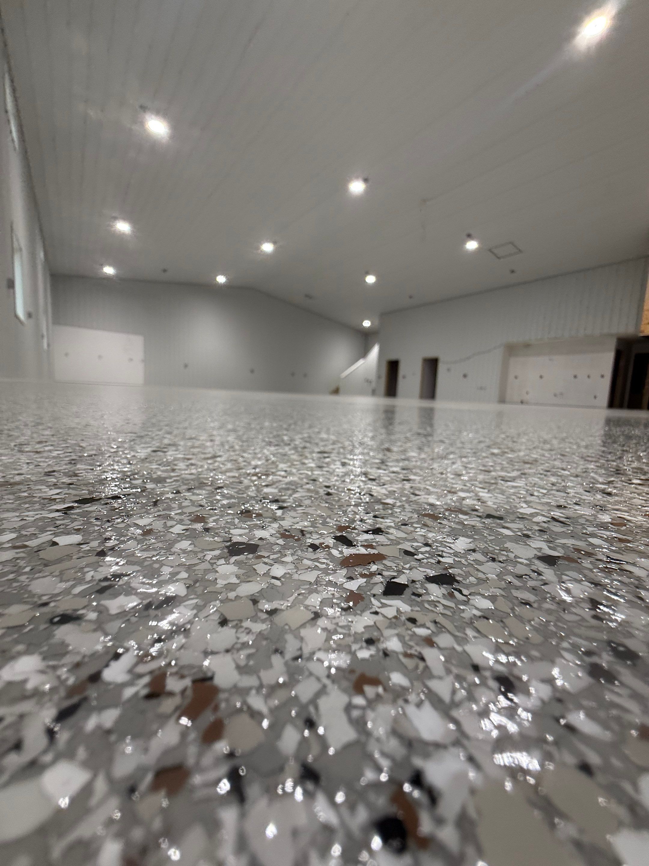 Custom Speckled Floor Coating for Large Montrose Shop by Select Painting, Coatings & Garage Cabinets