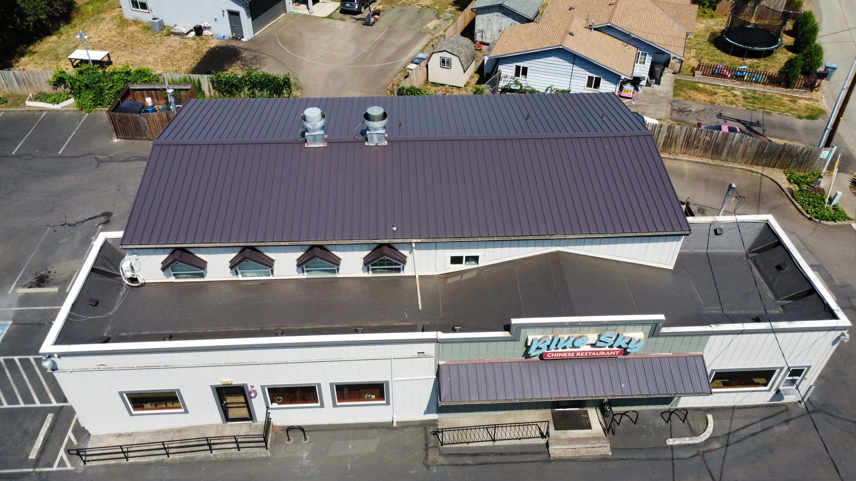 Commercial Flat Roof Installation using Bruce and Dana Snap Lock Metal (Color: Brown) by Orezona Building & Roofing Company, Inc.