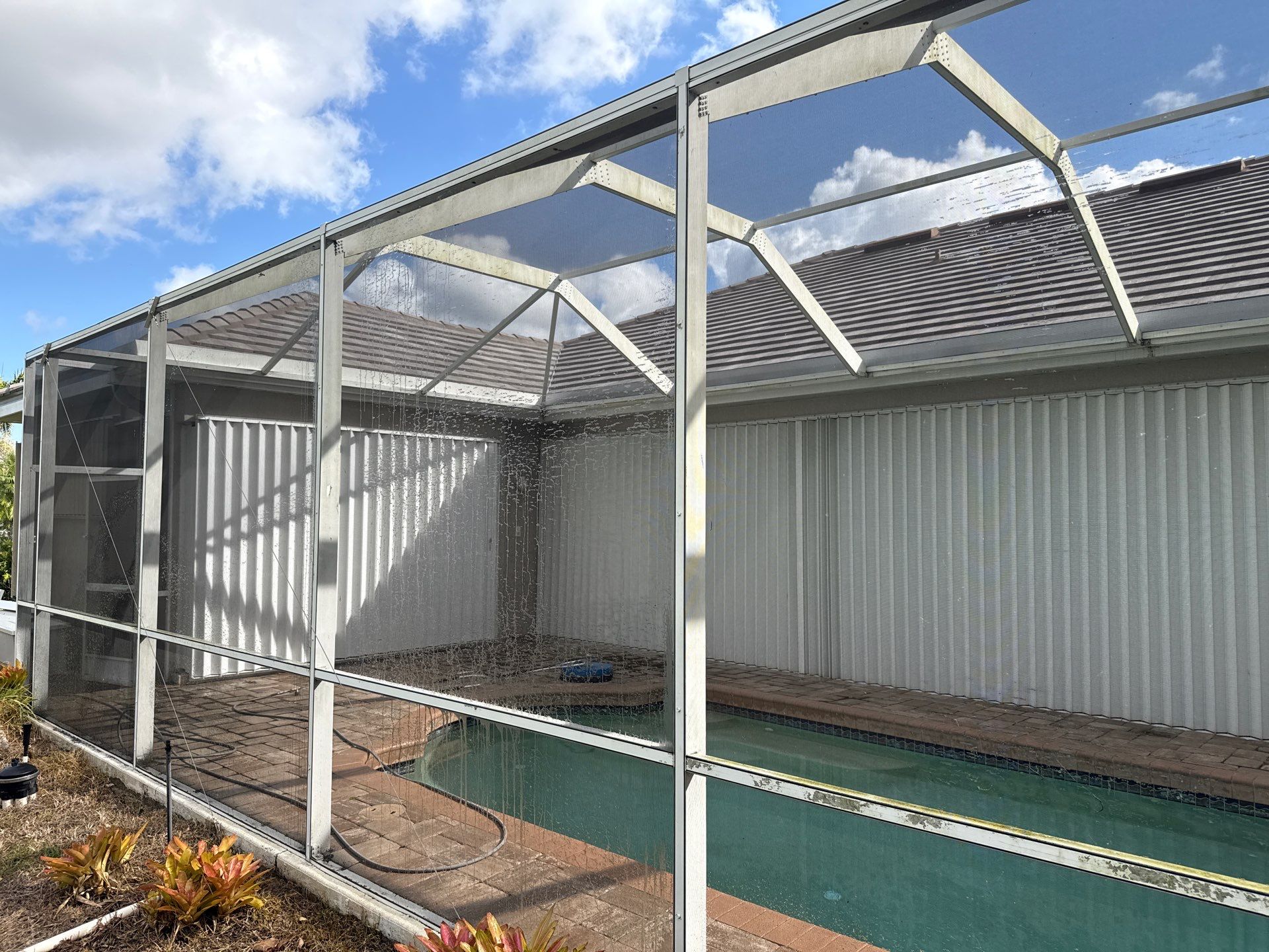 Paver Pool Deck & Screen Enclosure Transformation | University Park, Sarasota FL by Sunshine AquaWash