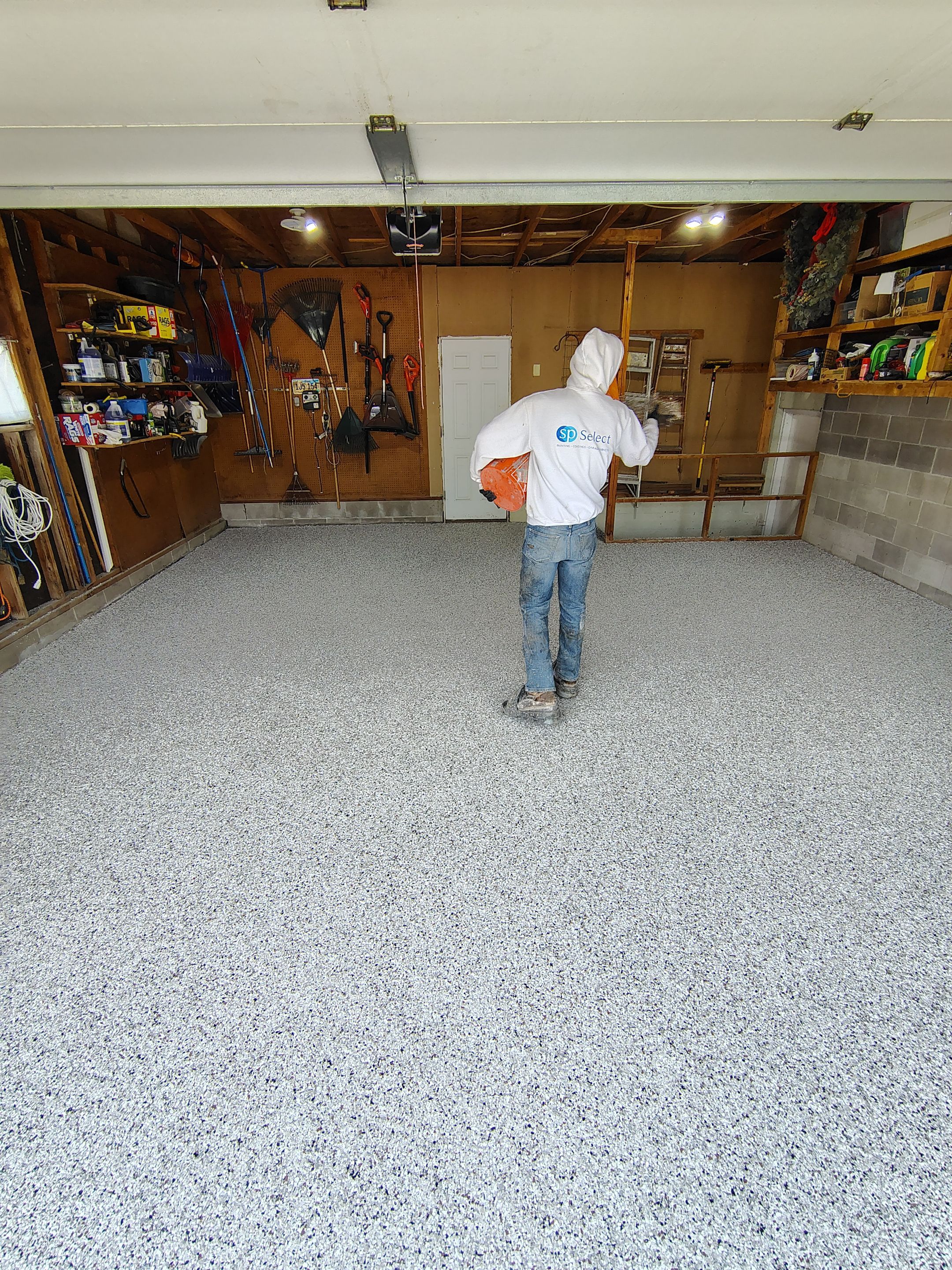 Sioux Falls Garage Epoxy Floor Installation and Concrete Crack Repair by Select Painting, Coatings & Garage Cabinets
