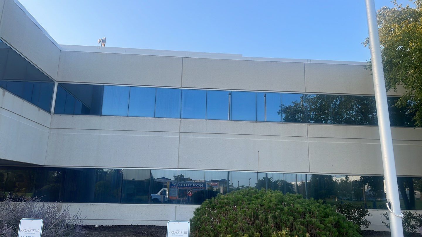 commercial pressure washing using Algaecide, soft wash soap by Northern Power Washing LLC.