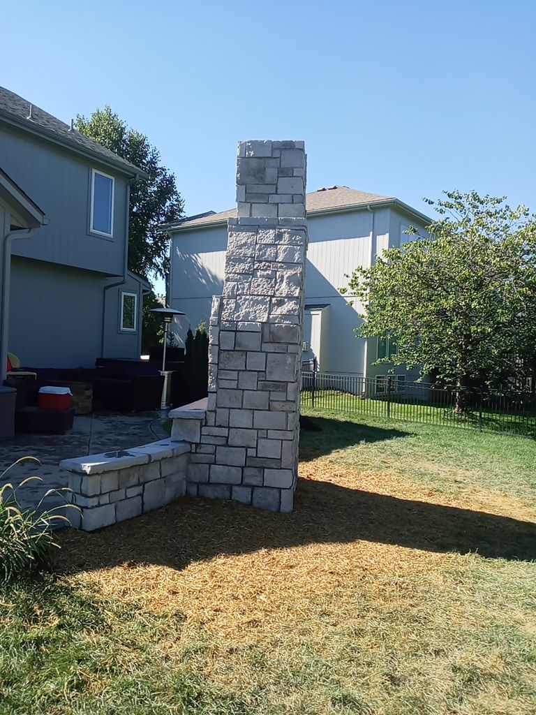 Back Yard Fireplace and Landscape by LAND ESCAPES LLC