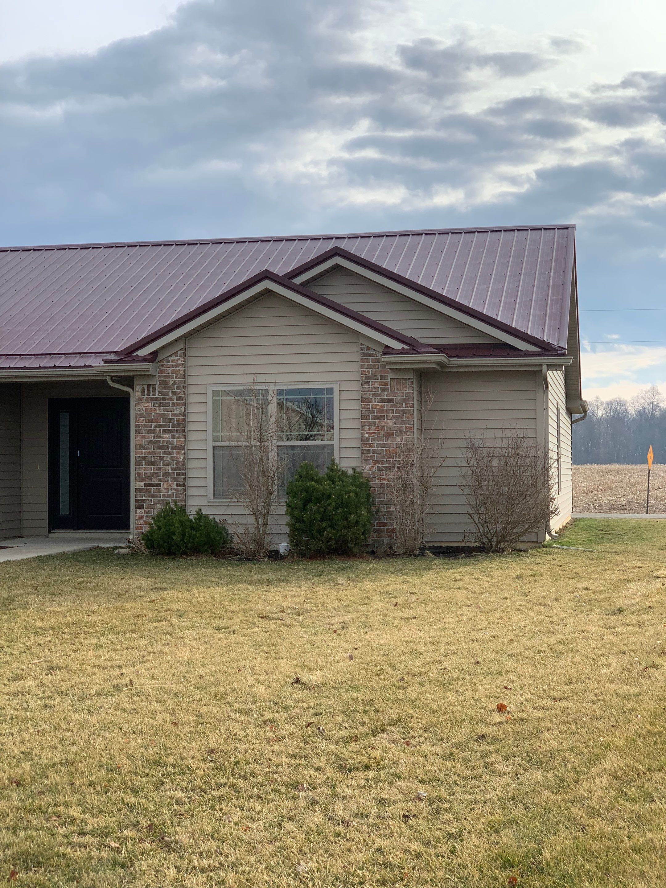 Burgundy Exposed Fastener Metal Roof in Columbia City, Indiana Country Home by 4Ever Metal Roofing