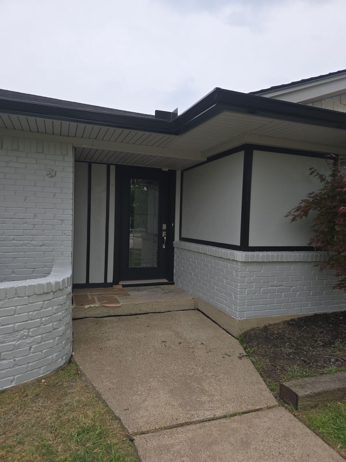 Exterior Home Paint Project with Different Surfaces by SLM General Contractors & Roofing