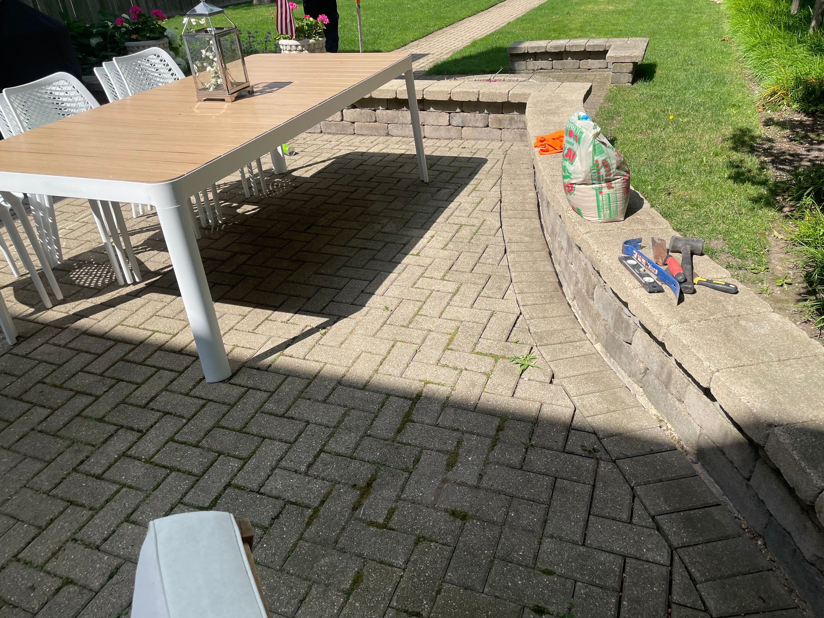 Brick patio repair, clean sand and seal by Northern Power Washing LLC.