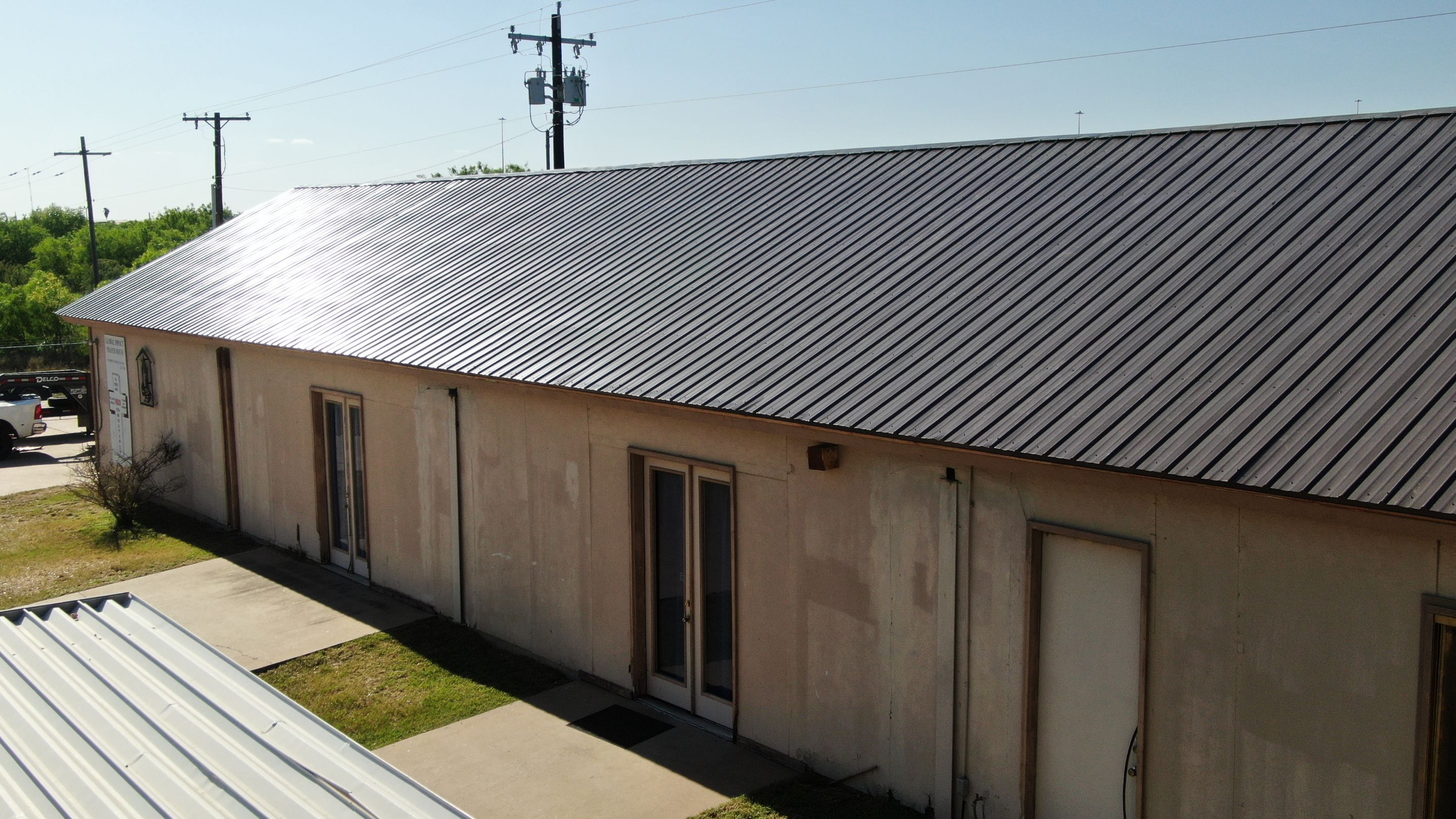Residential Roofing Installation using Classic Rib Metal Roof by JM Flores Roofing & Construction, Inc