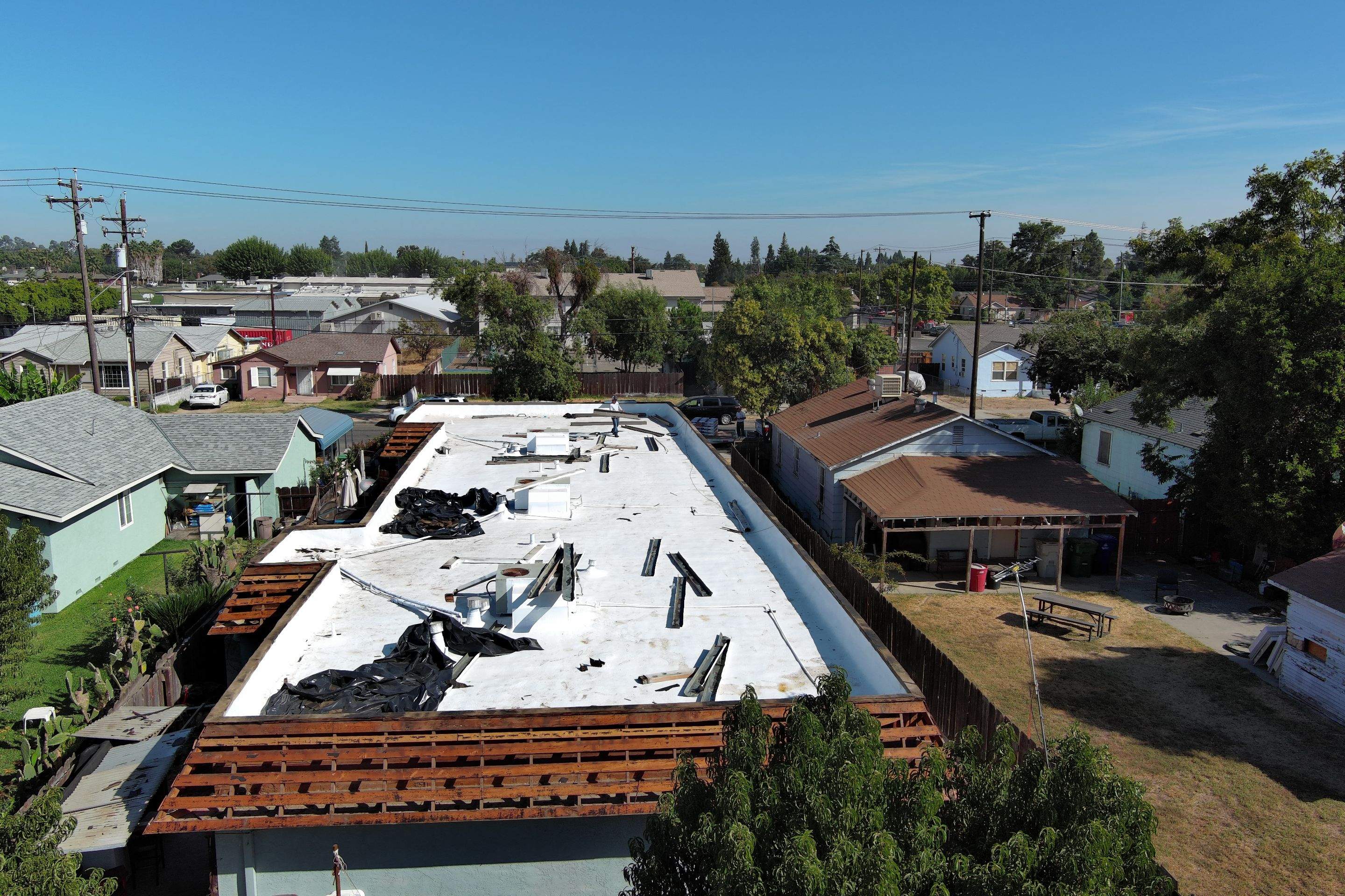 Foam Refurbish using Conklin Benchmark/PUMA XL coatings and spray foam; Also metal roofing around parapet wall by Straight Edge Roofing Inc
