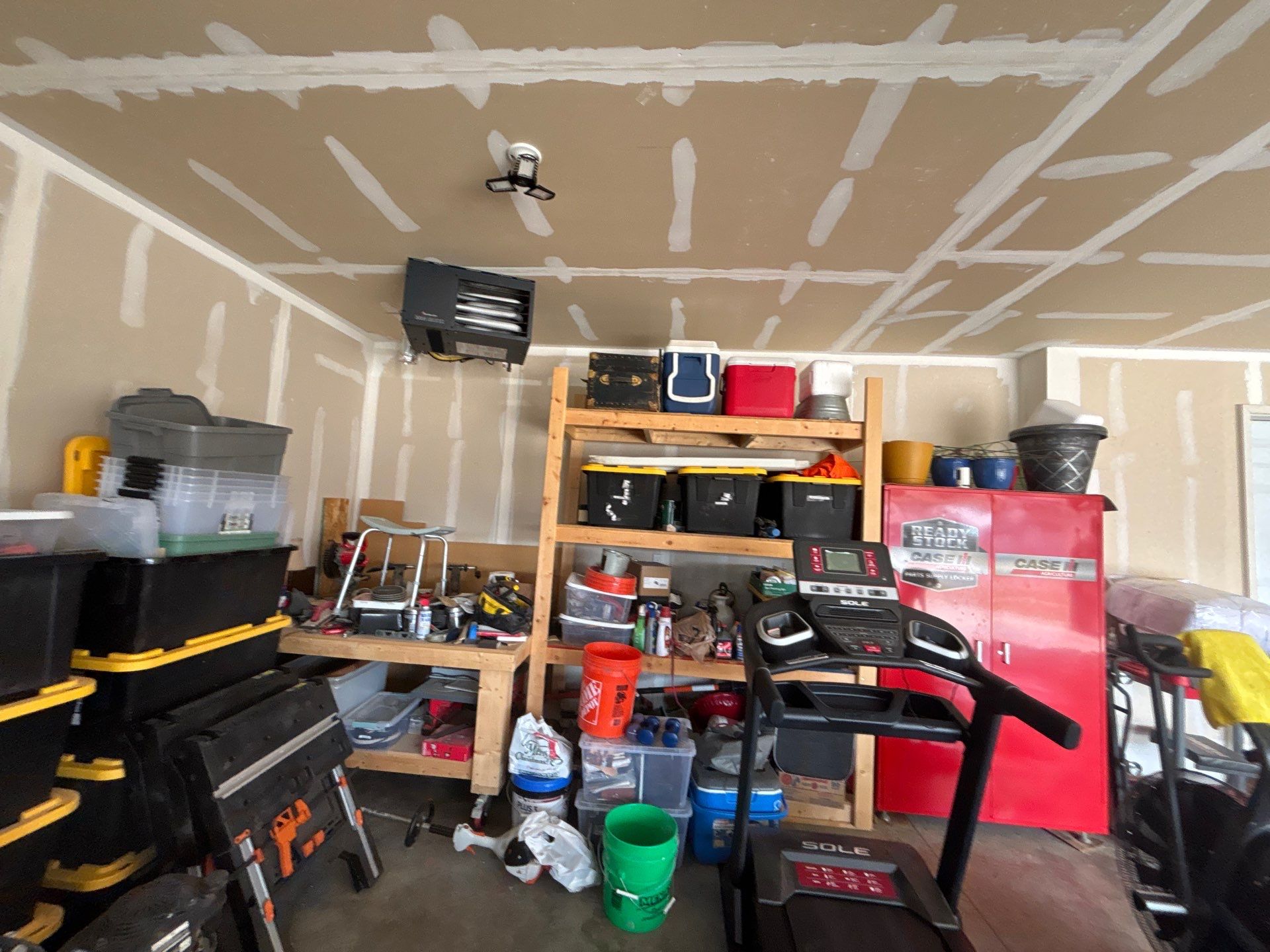 Grey Flake Epoxy Garage Floor Coating in Sioux Falls by Select Painting, Coatings & Garage Cabinets