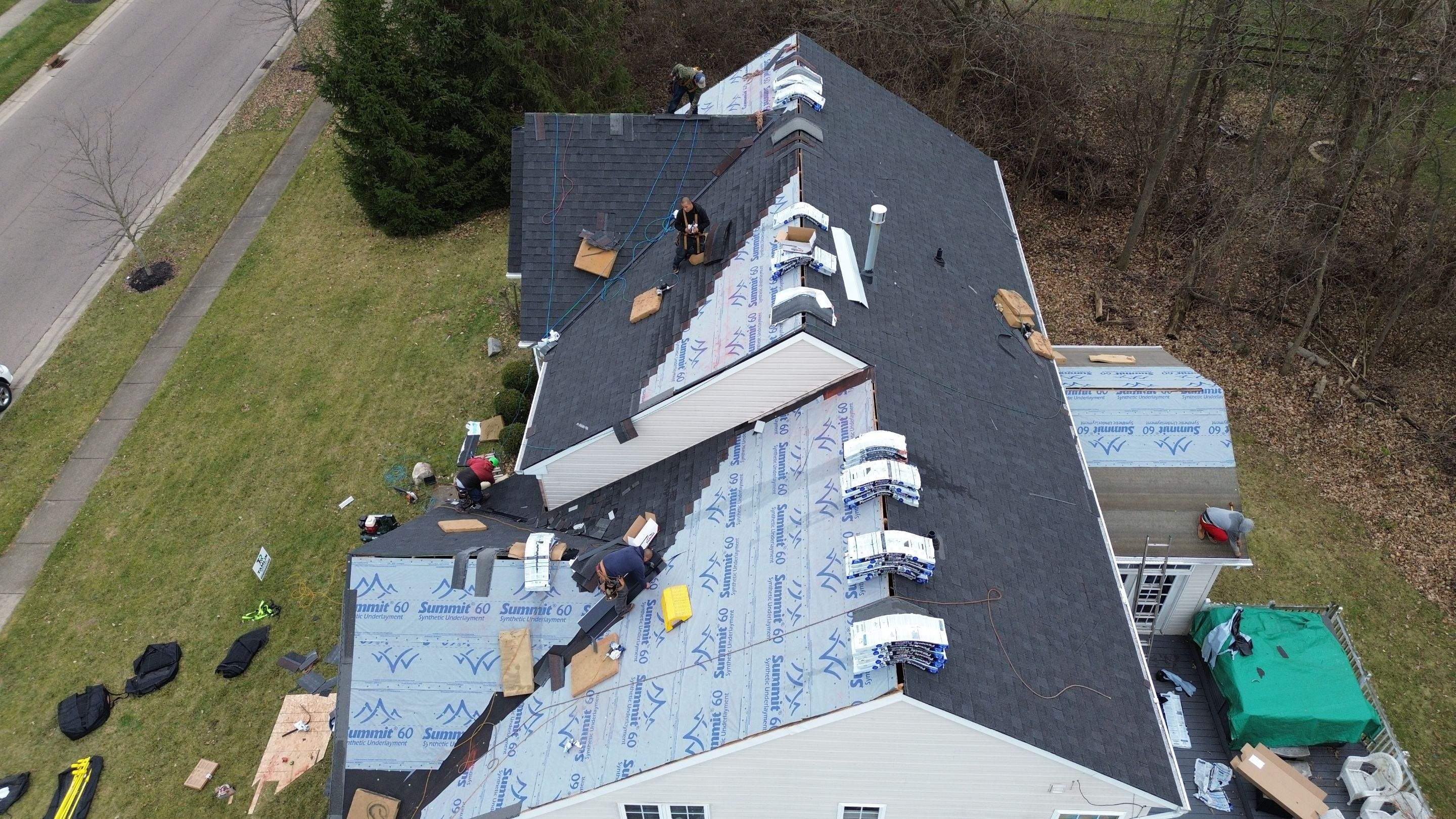 Walden Ponds - Pristine Black and Hydro Flo Gutter Guards by Tamlin Roofing