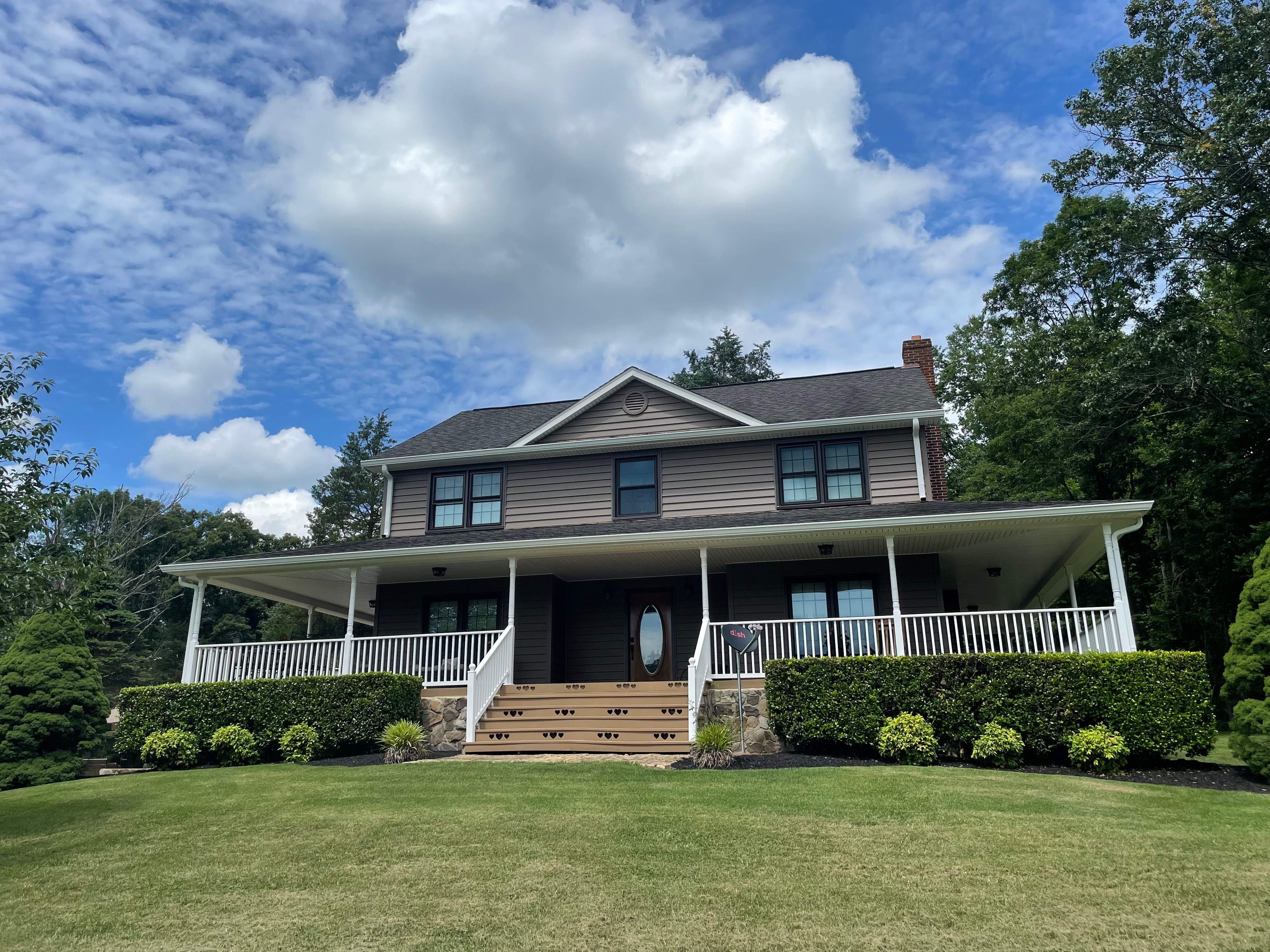 Exterior remodel including window replacement by American Home Contractors