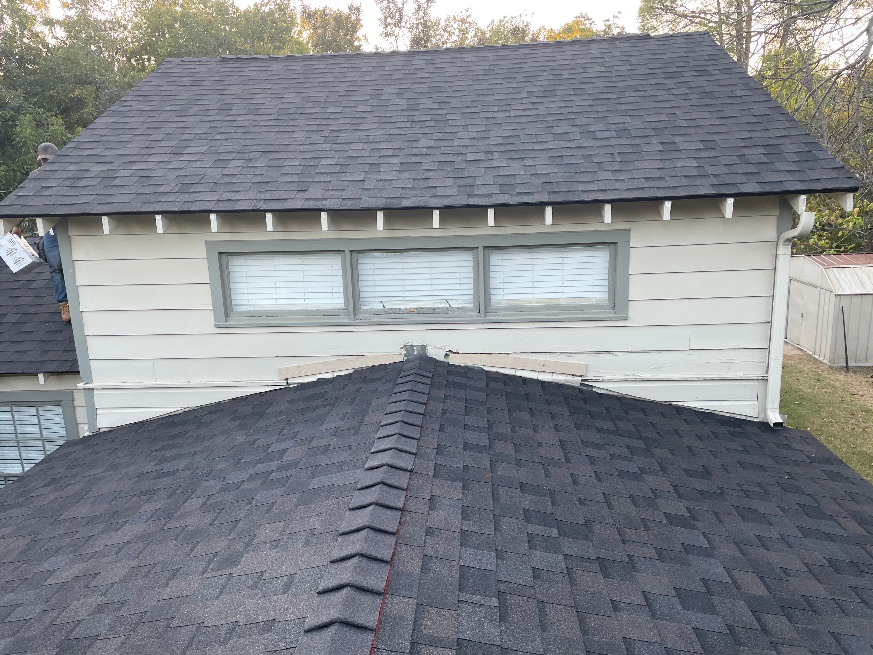 White exterior with IKO Glacier by Tejas Roofworks + Restoration