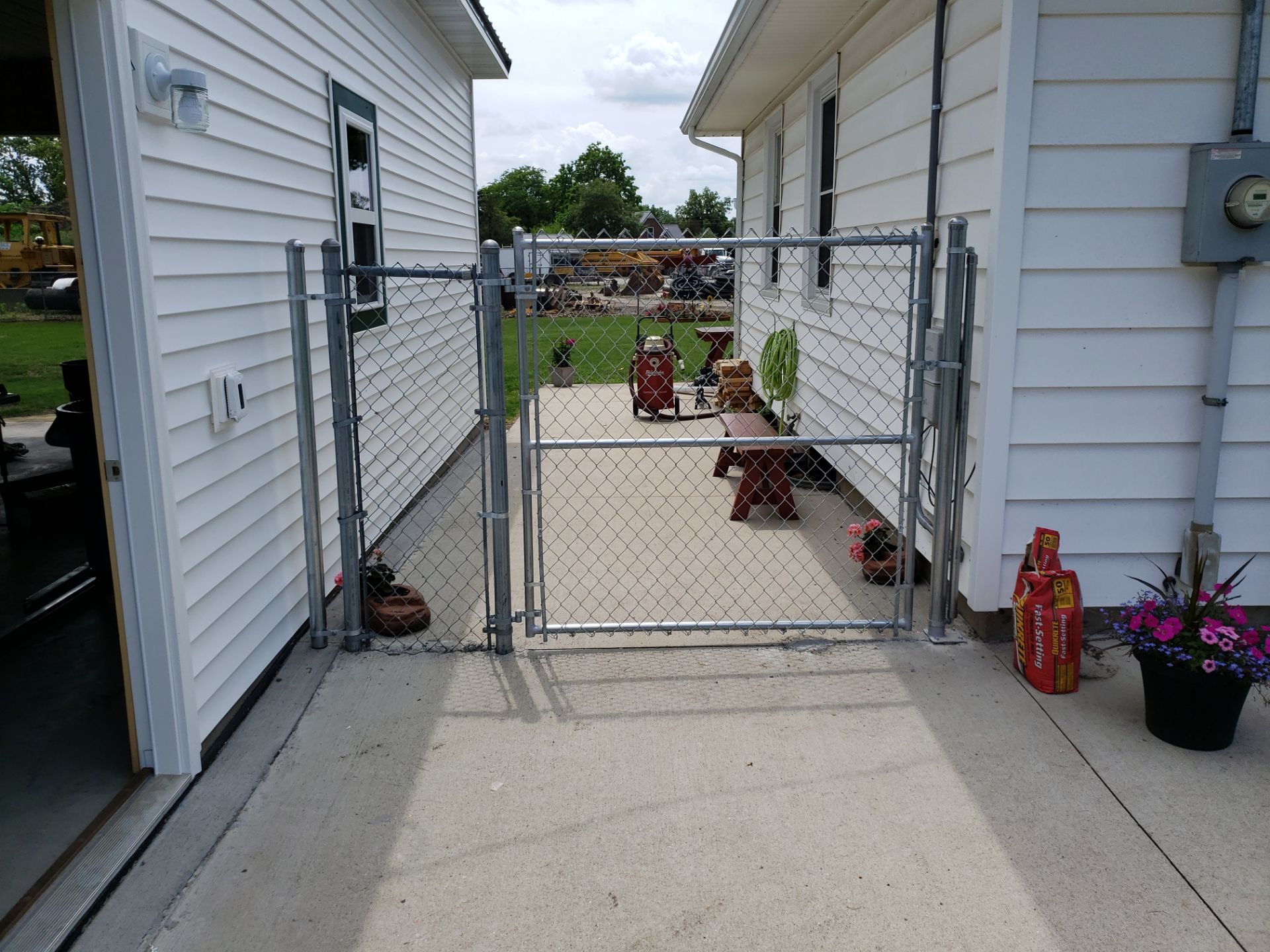 Residential Chain Link Fence and Gate Installation in Washburn by Perfect Picket Fence and Stain