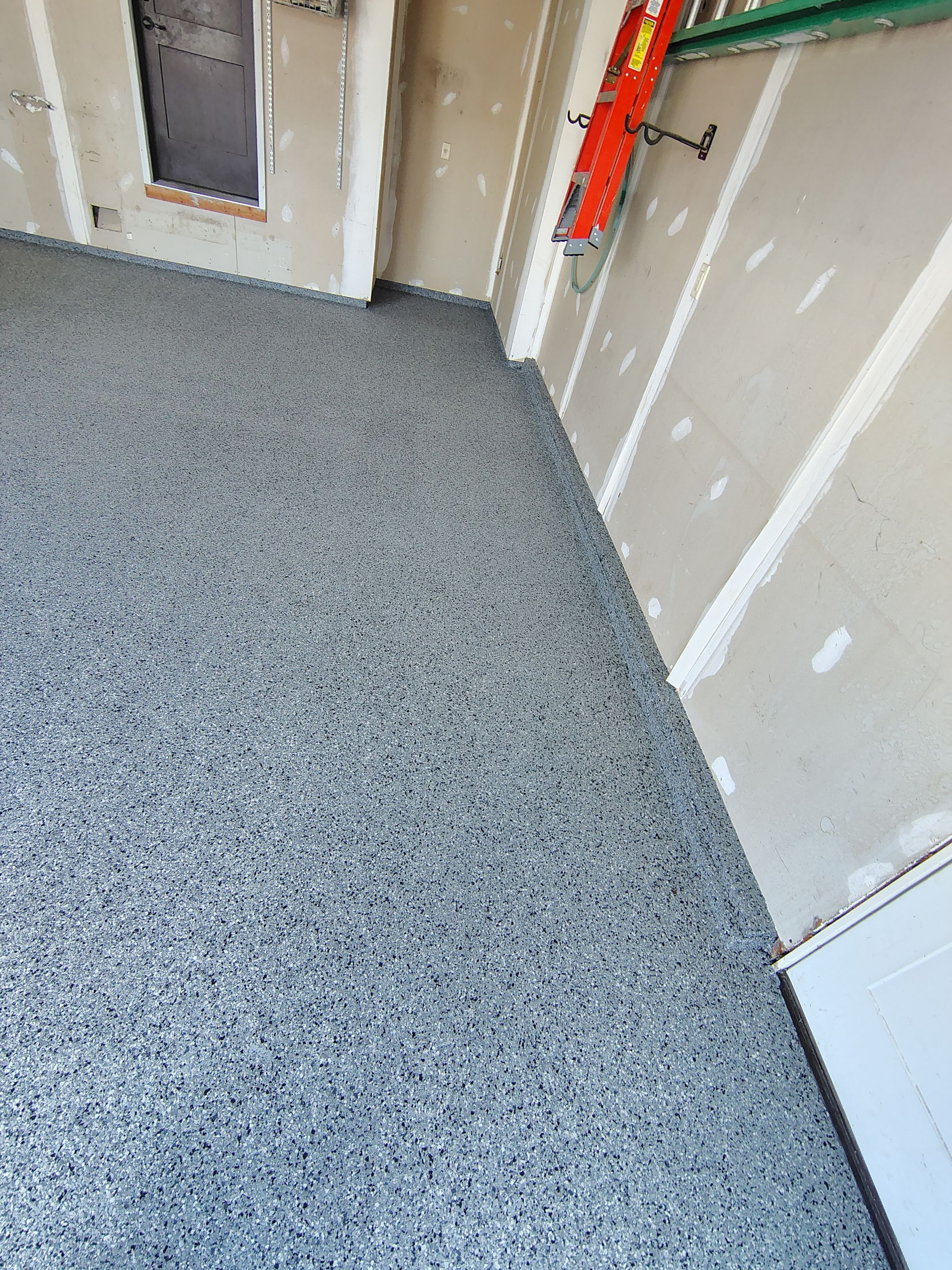 Sioux Falls Garage Concrete Grinding and Nightfall Decorative Chip Coating by Select Painting, Coatings & Garage Cabinets