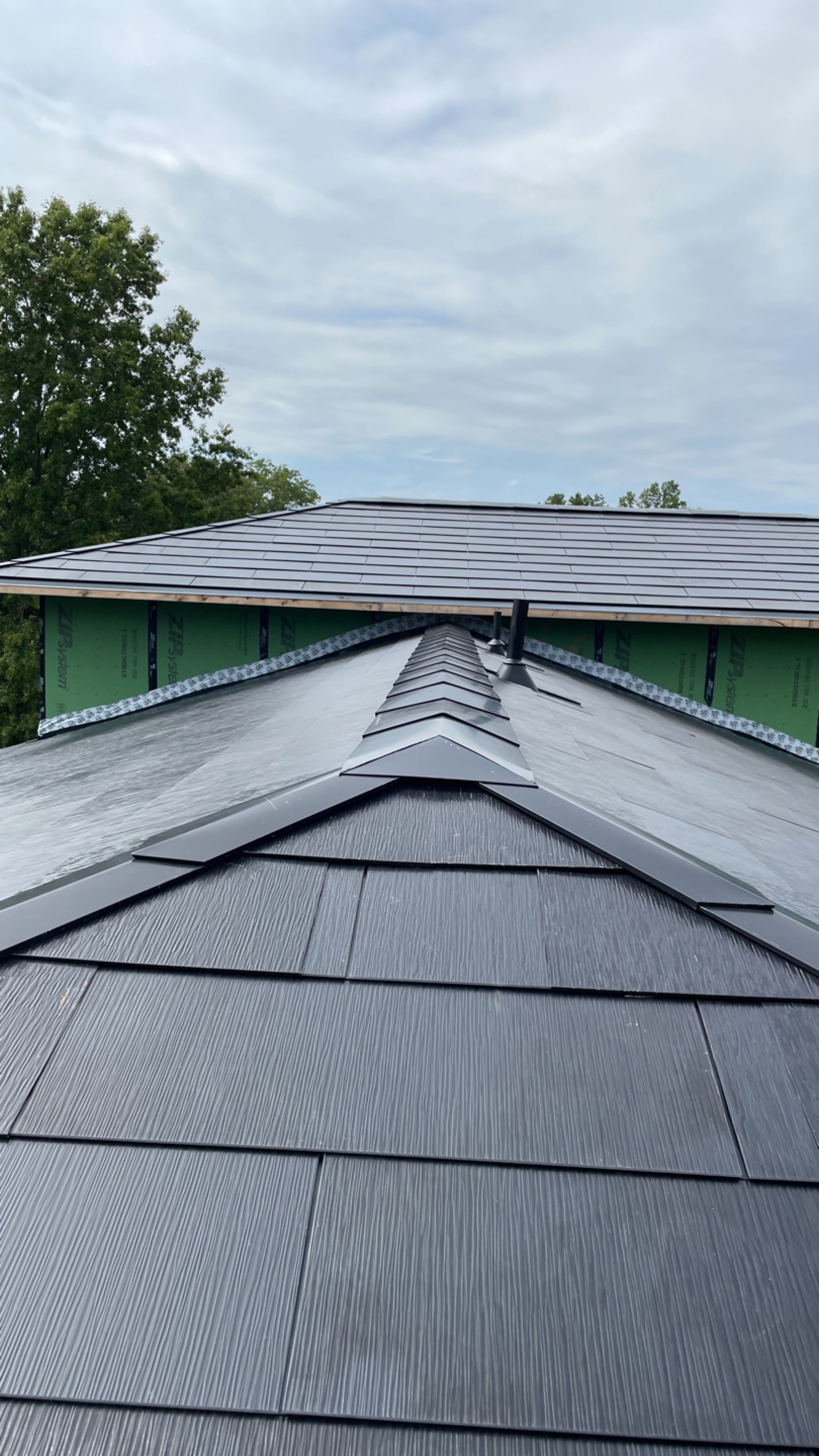 Tesla Solar Roof  using Tesla Solar Roof V3 tiles by American Home Contractors