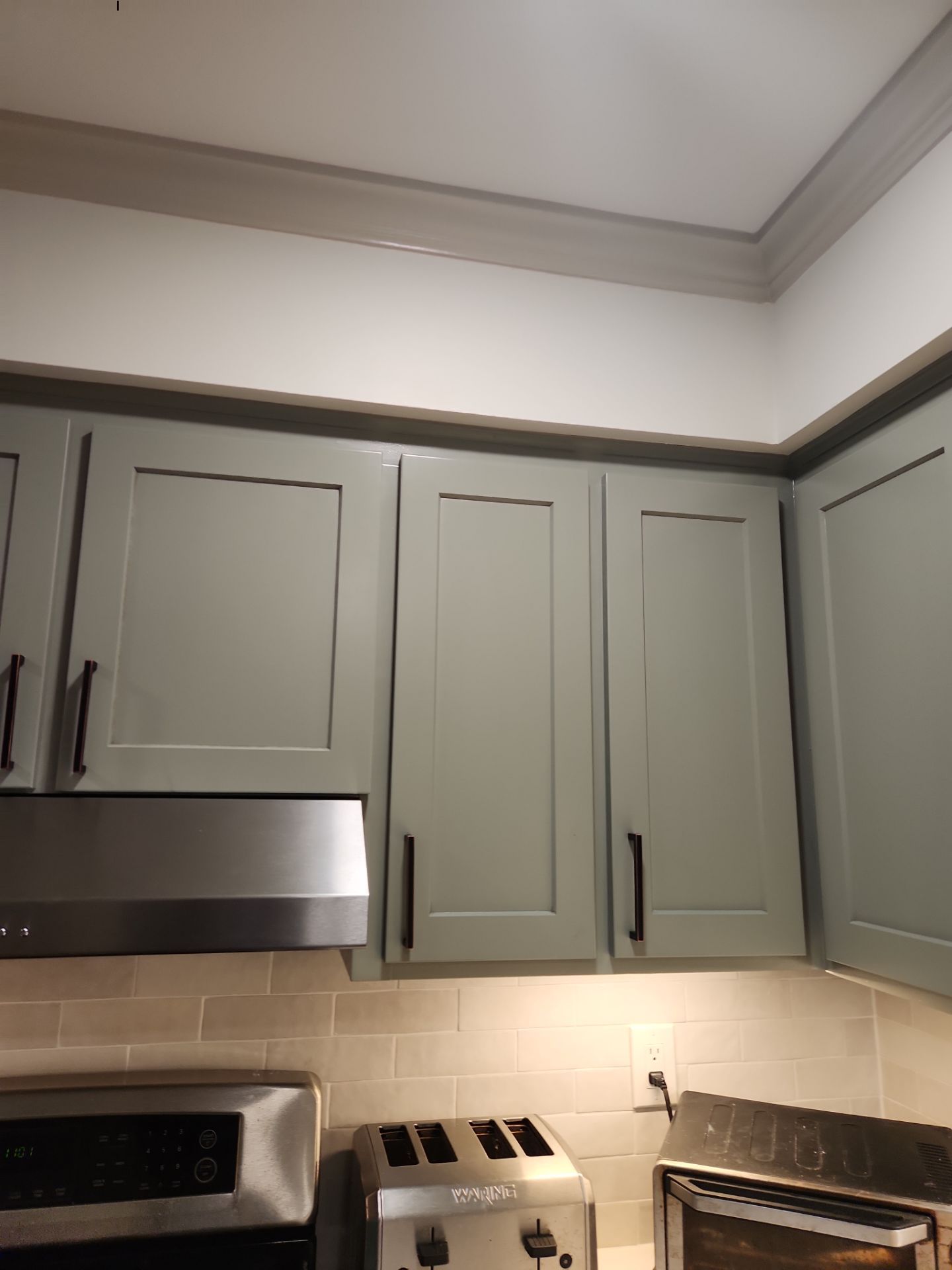 A Pathway to Personality – A Two-Tone Kitchen Transformation in Apex by Elite Remodeling and Design LLC
