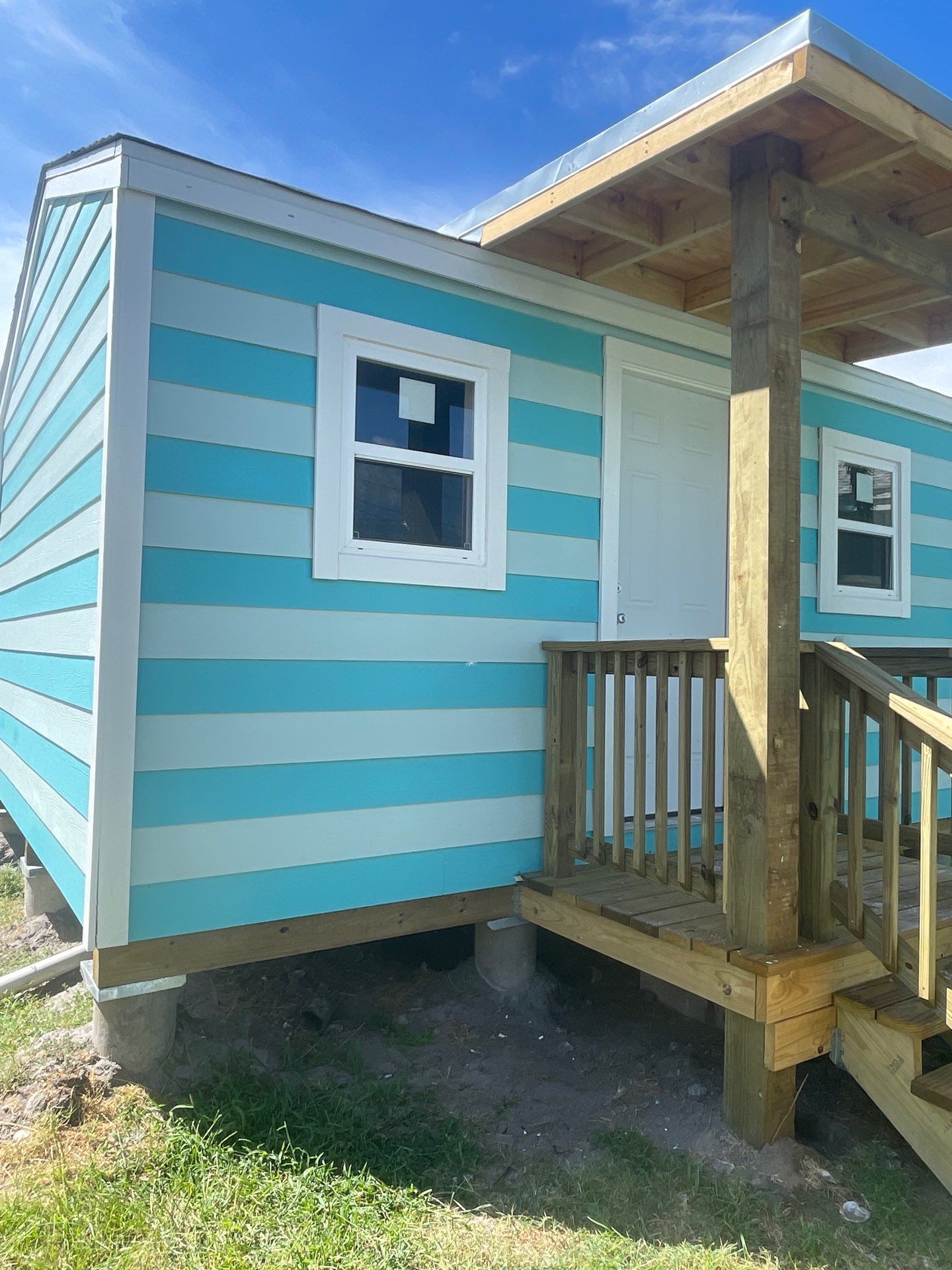 Stripped Beach Bungalow  by Bayfront Roofing and Construction