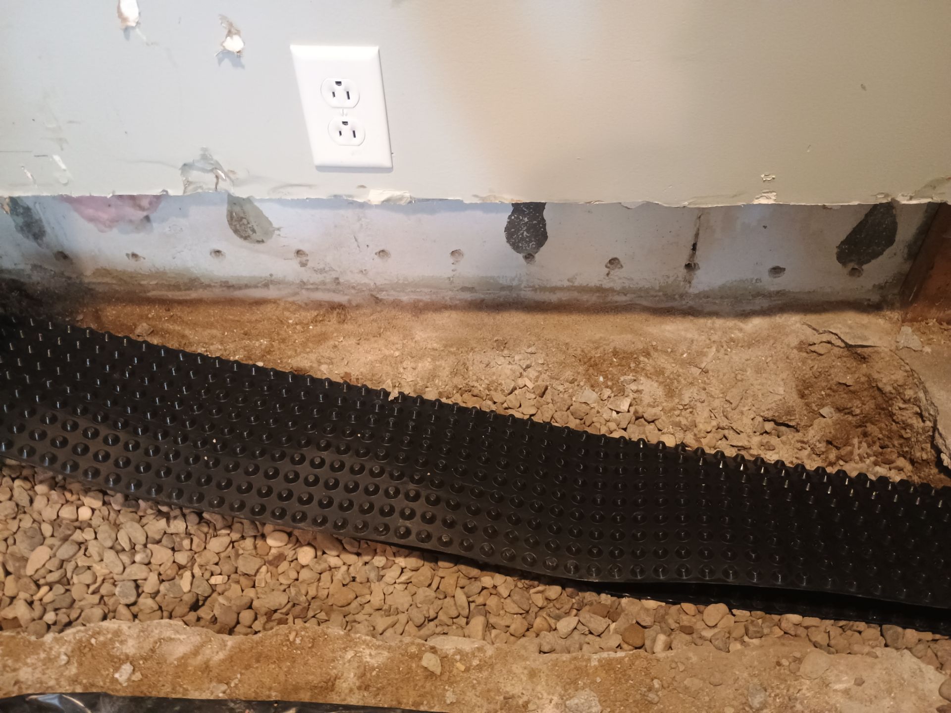 Interior Drain Tile in a Finished South Minneapolis Basement by Waterproofing Northeast