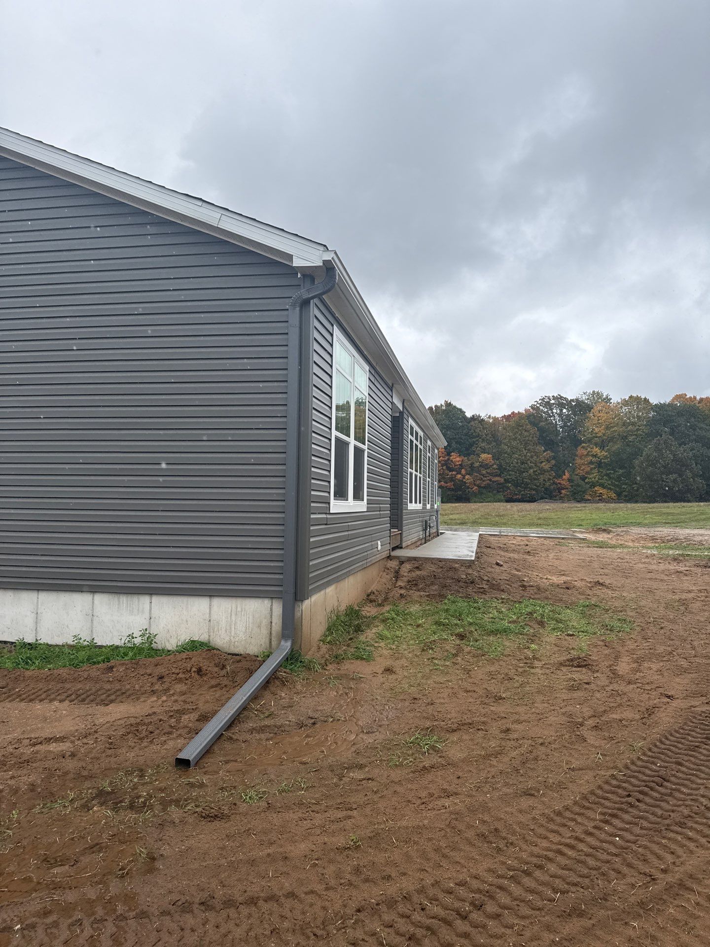 Gutter and Downspout System Installation for Manistee Residential Property by Rainbow Seamless Systems