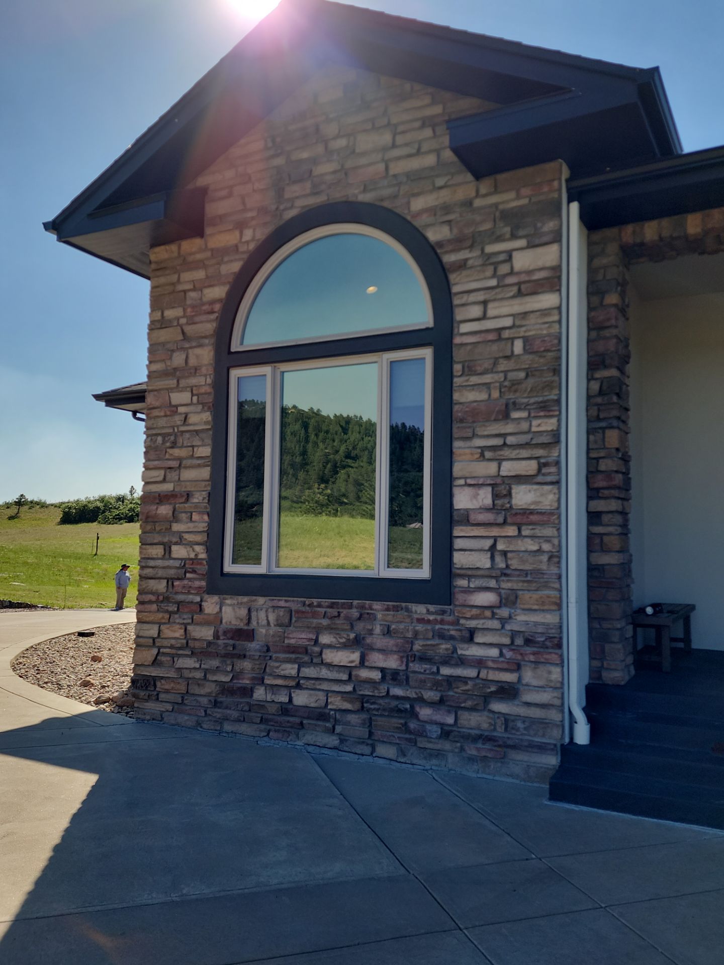 Castle Rock Elegance: White Stucco Exterior with Bold Tricorn Black by J&M Painting LLC