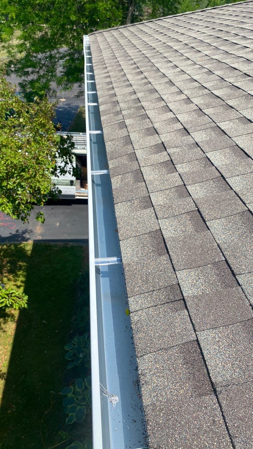 Asphalt Roof Replacement and Aluminum Gutter Installation by Custom Installations