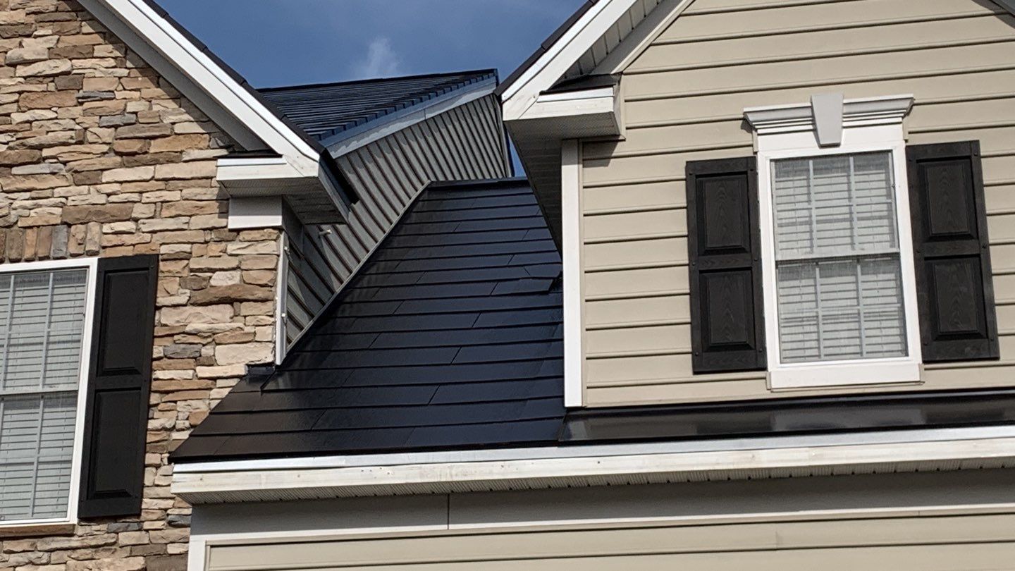 Tesla Solar Roof and Gutter Installation by American Home Contractors