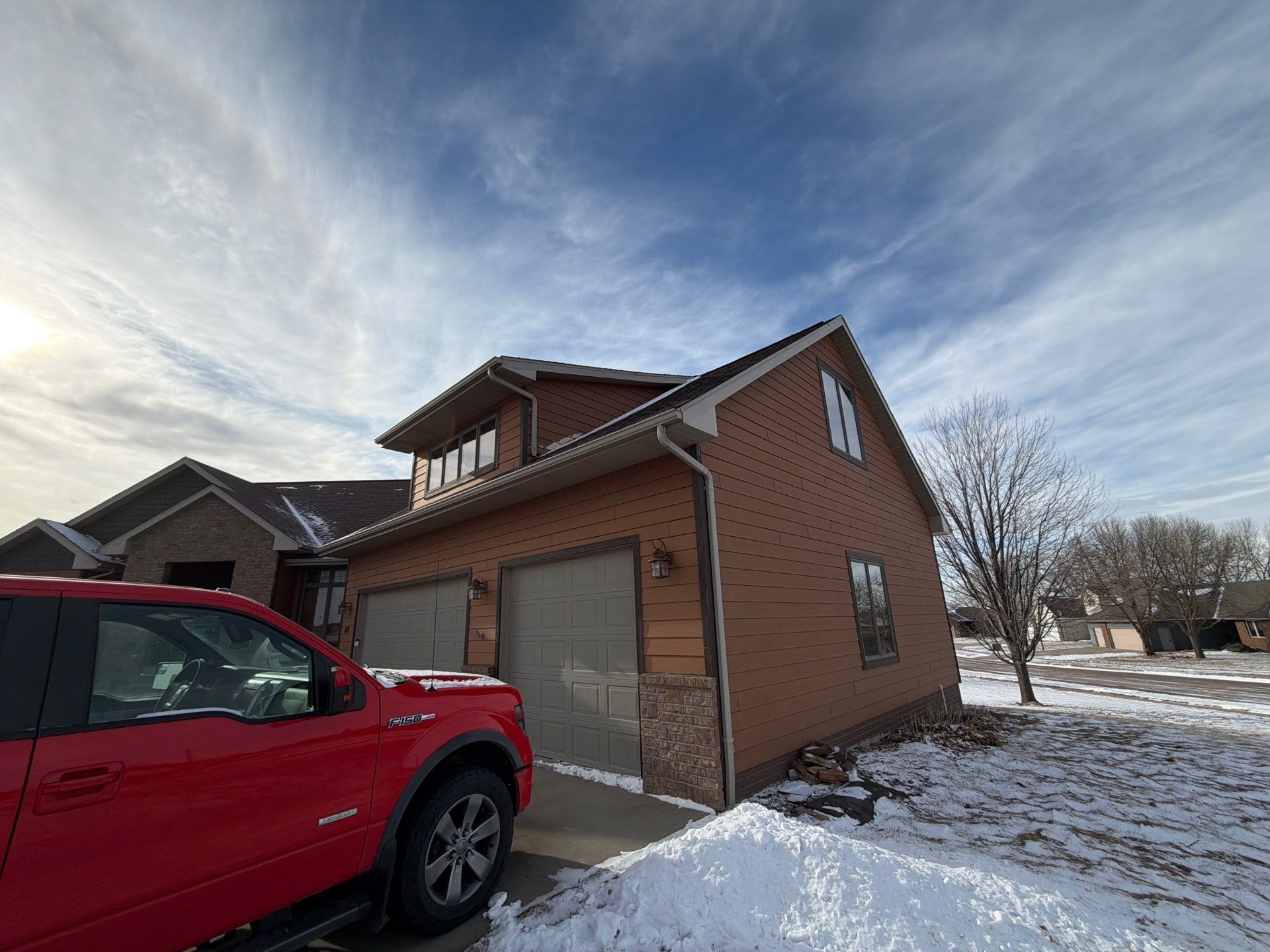 Residential Exterior Painting and Siding Restoration in Crooks by Select Painting, Coatings & Garage Cabinets