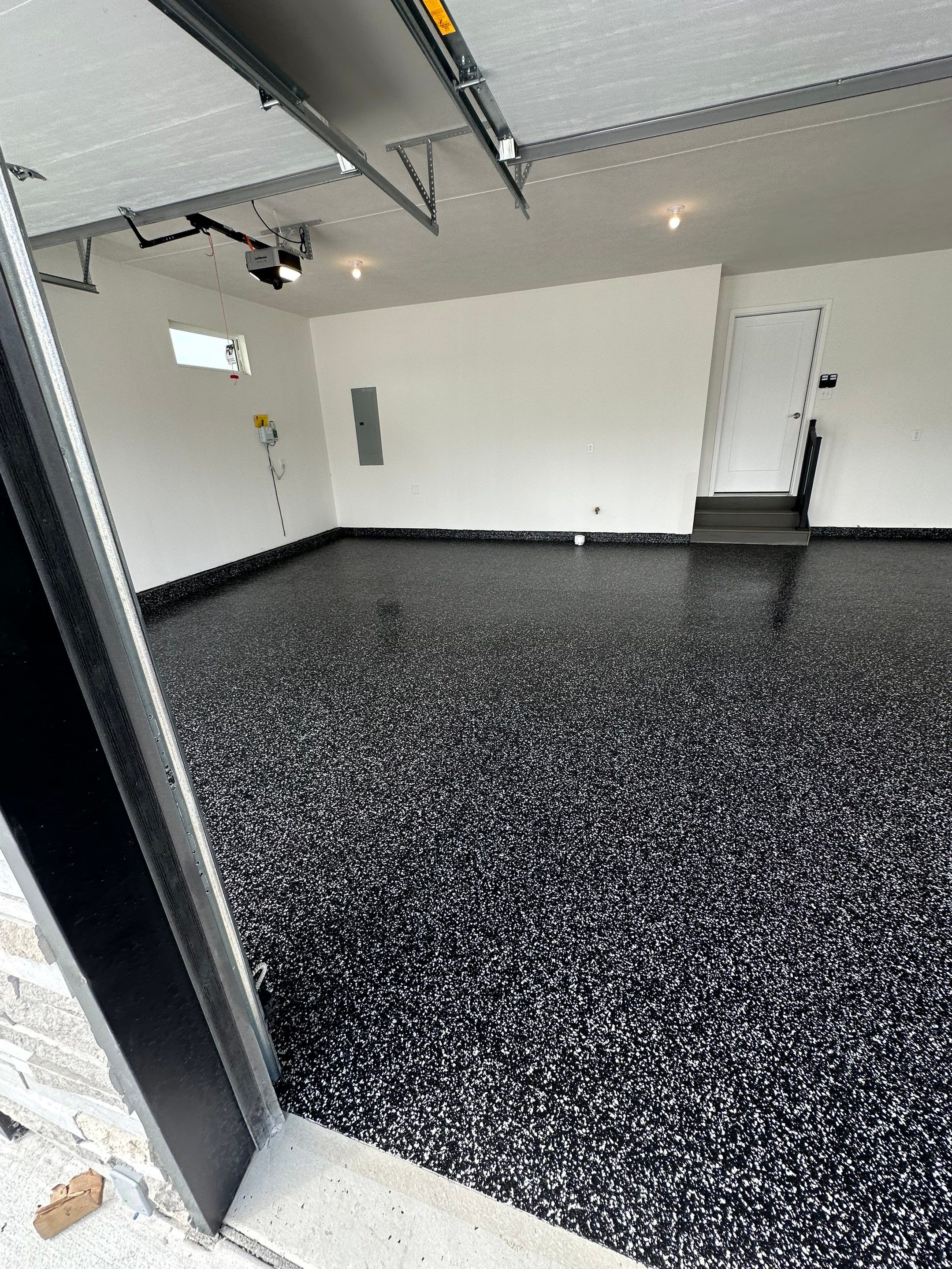 Black and White Speckled Epoxy Garage Floor in Lincoln by Goat Coatings