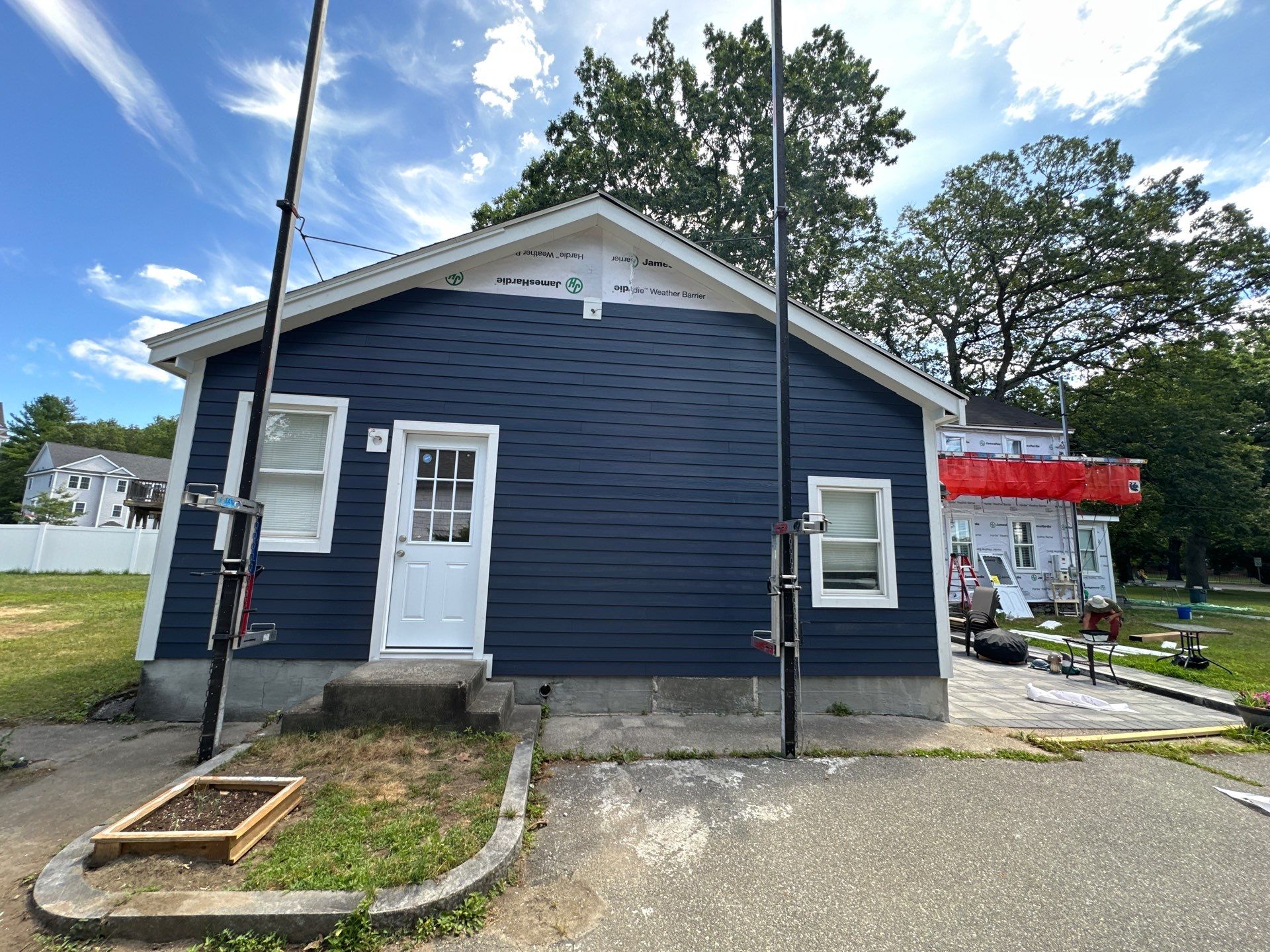 James Hardie Lap Siding Installation in Chelmsford, MA by Mighty Dog Roofing of Greater Middlesex County