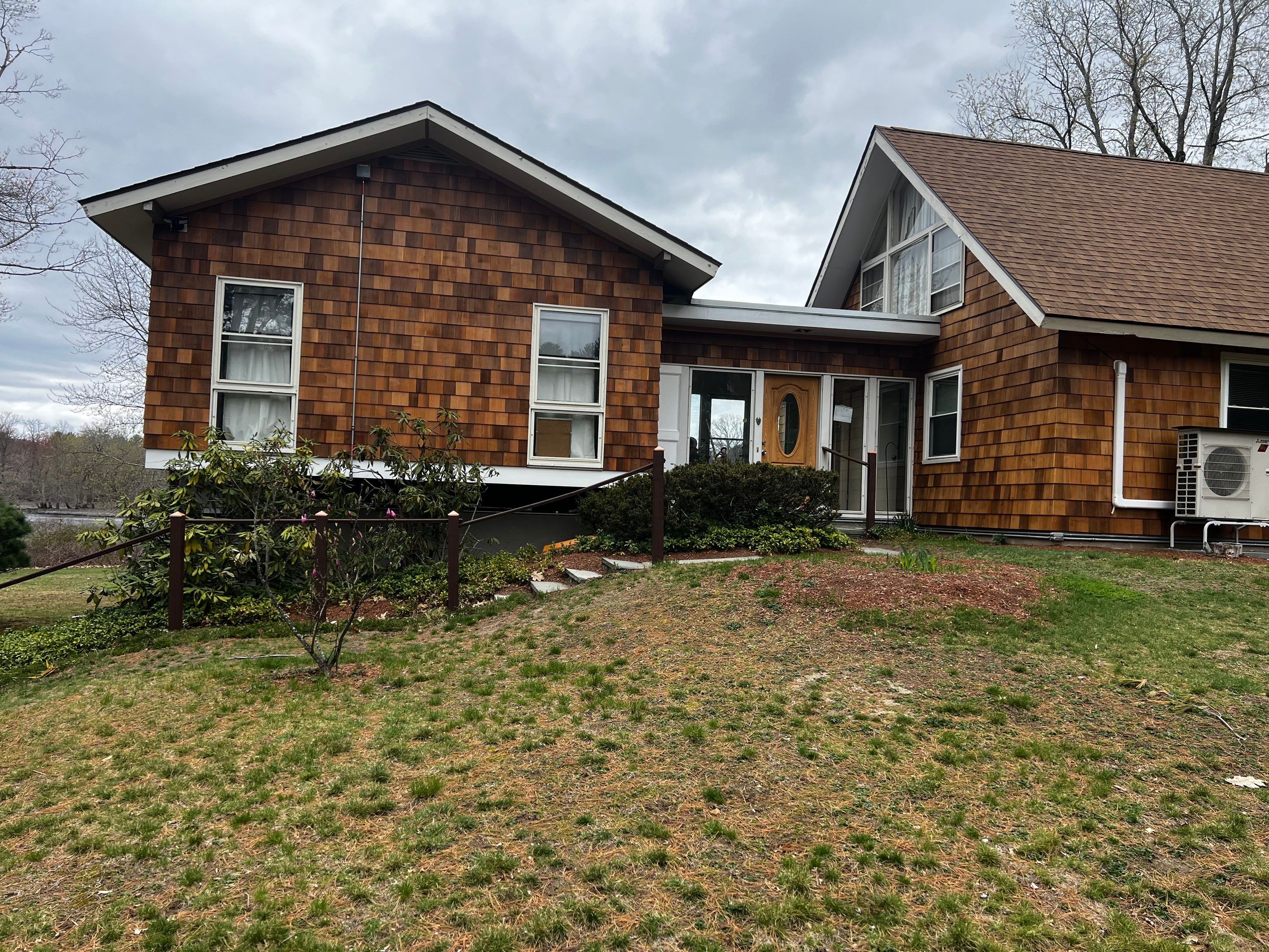 Siding Installation using Perfection Red Western Cedar Shingles  by Loyalty Exterior Solutions 