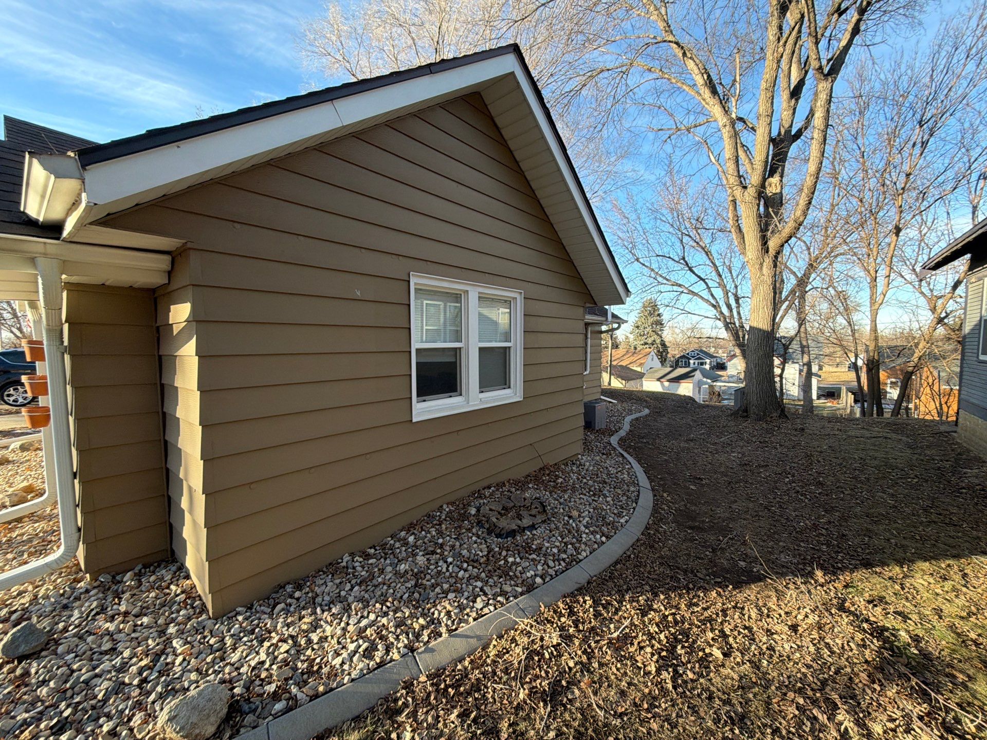 Exterior Siding Repair and Full House Repaint in Sioux Falls by Select Painting, Coatings & Garage Cabinets