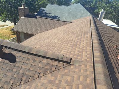 Hail-Marked Roof Replaced in Warm Brown — Houston, TX