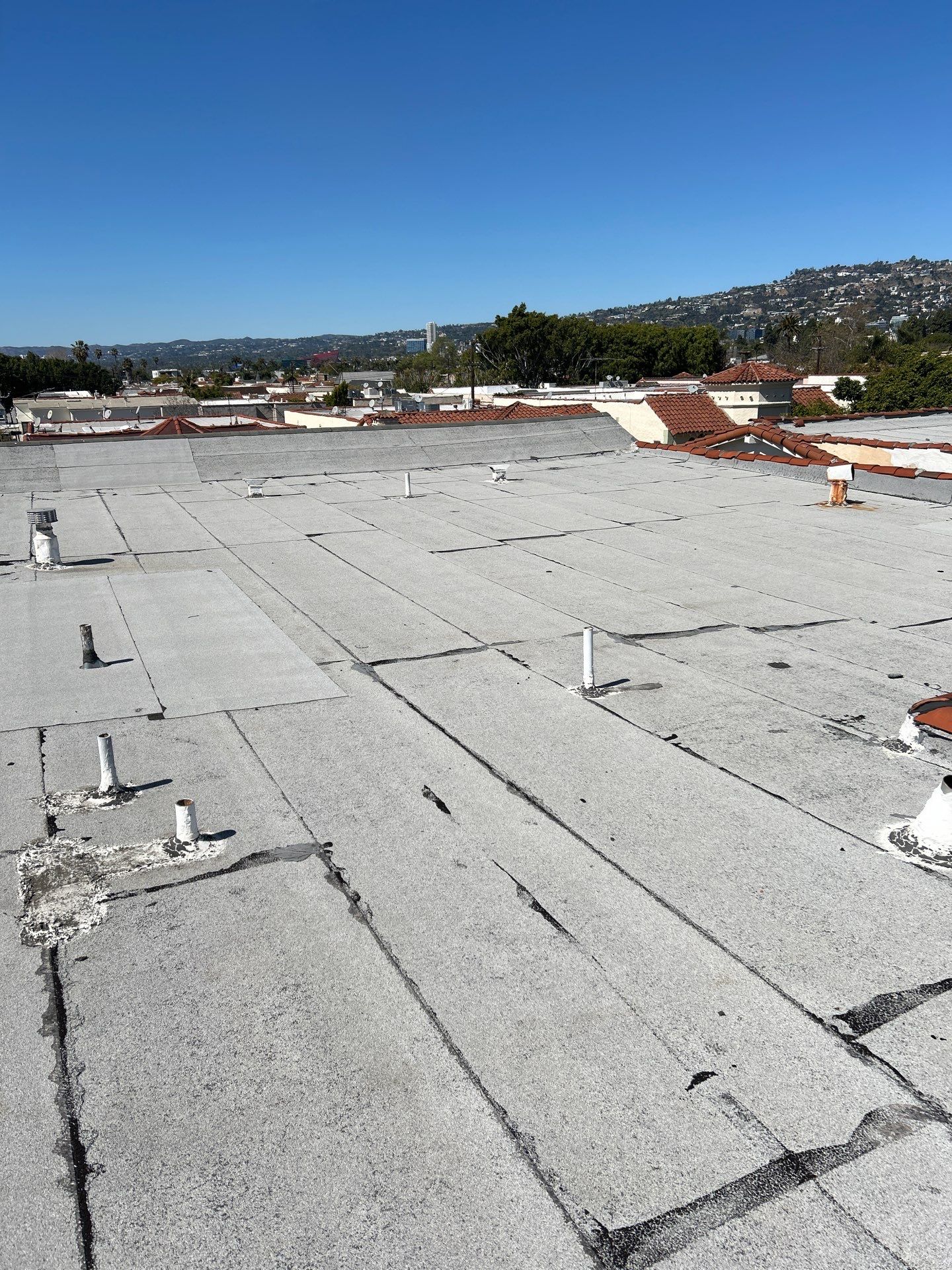 Apartment Building Reroofing using Polyfresko® G Highly Reflective Modified Bitumen Cap Sheet by Hull Brothers Roofing