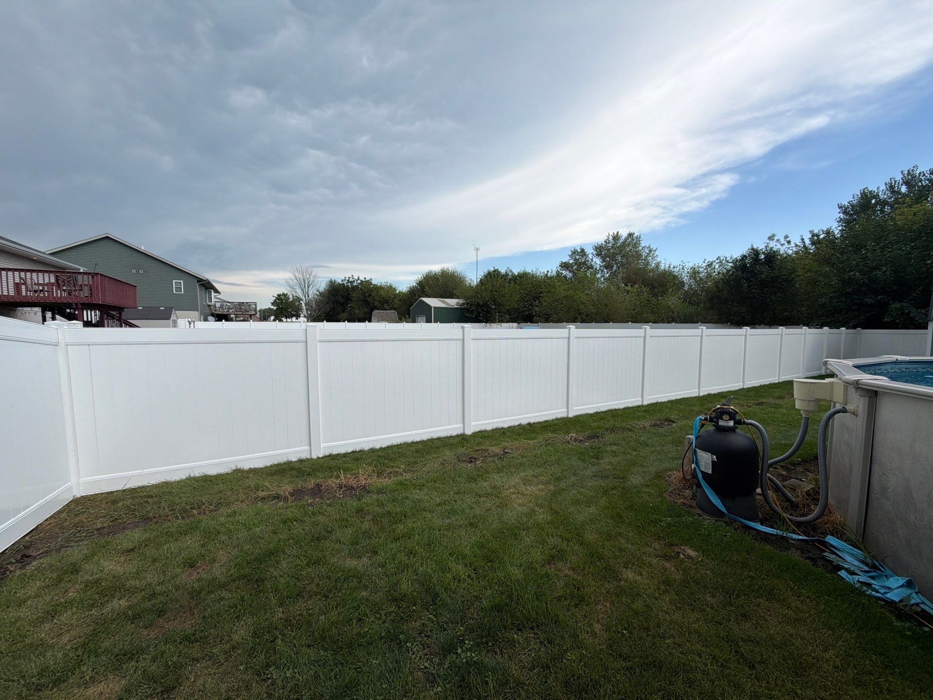 White Vinyl Privacy Fence Installation in Raymond, IA by Perfect Picket Fence and Stain