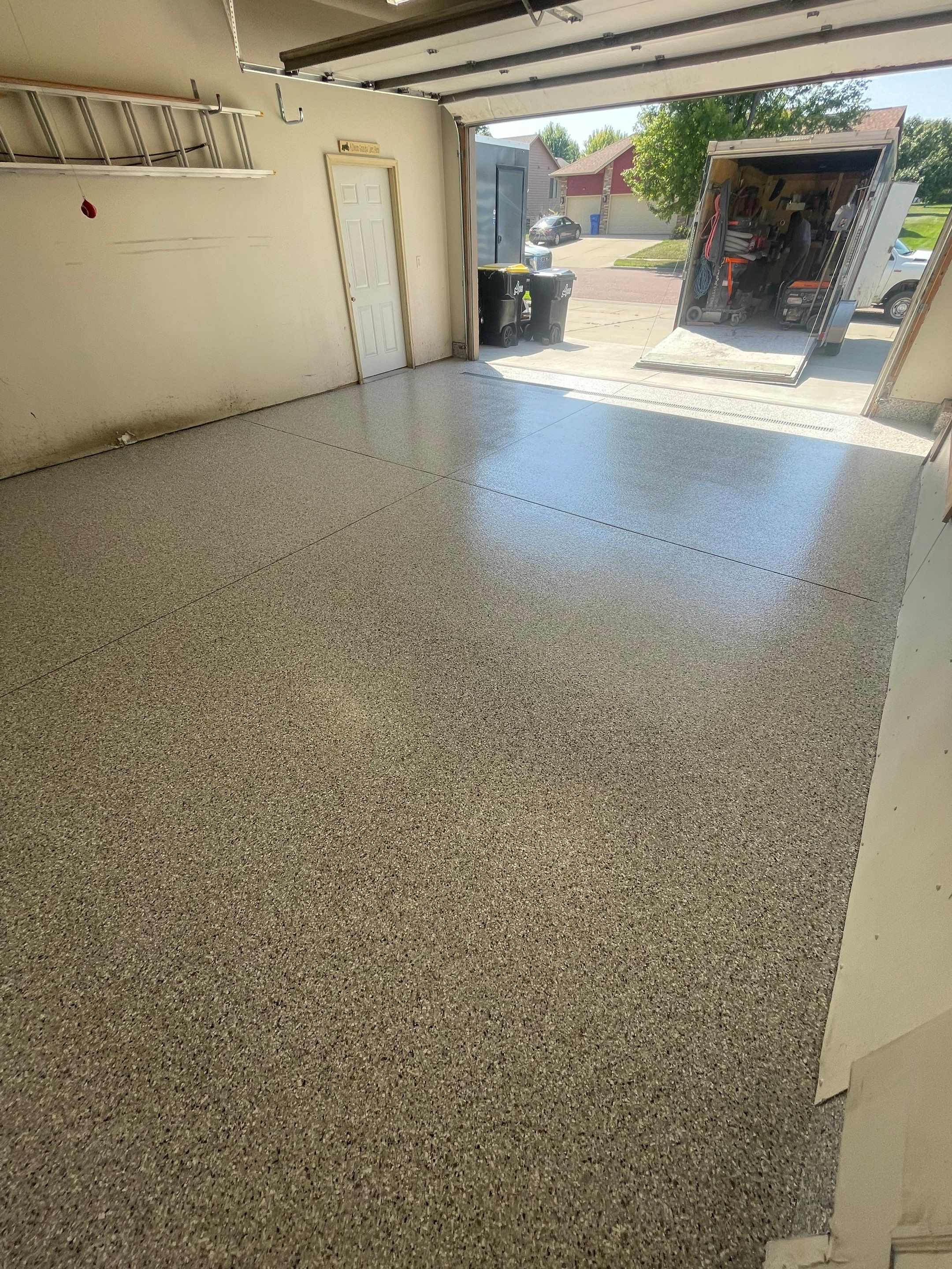 Multi-Stall Garage Floor Coating Installation in Sioux Falls by Select Painting, Coatings & Garage Cabinets