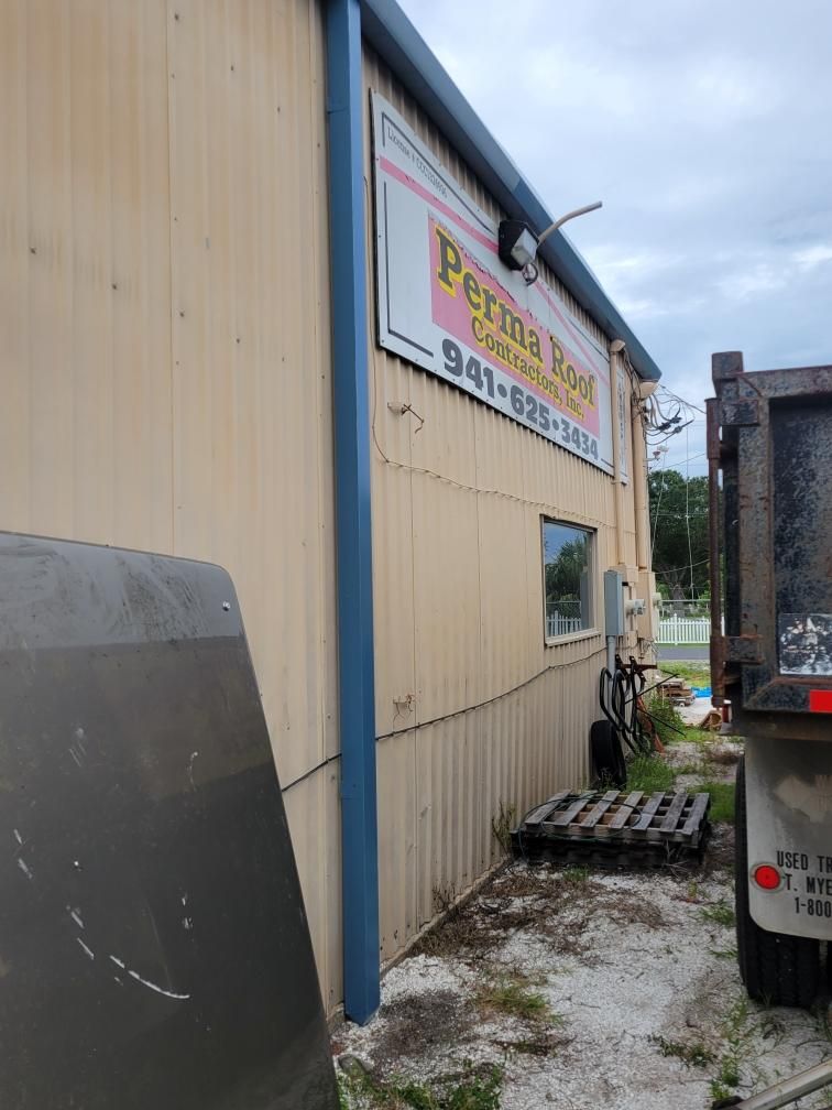 Black Aluminum Gutters with Matching Downspouts in Port Charlotte, FL by Gutter Professors