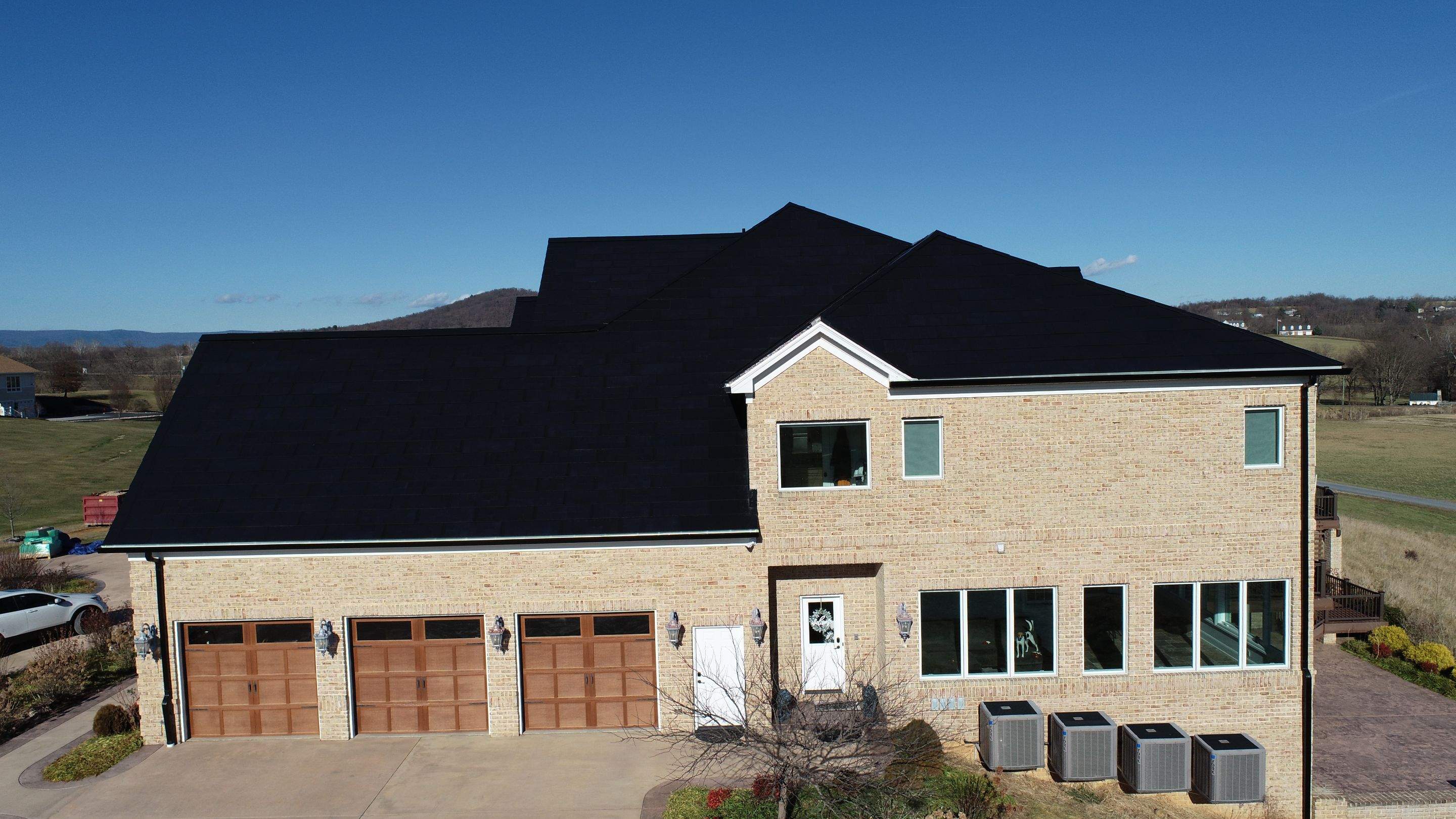 Tesla Solar Roof Replacement  by American Home Contractors