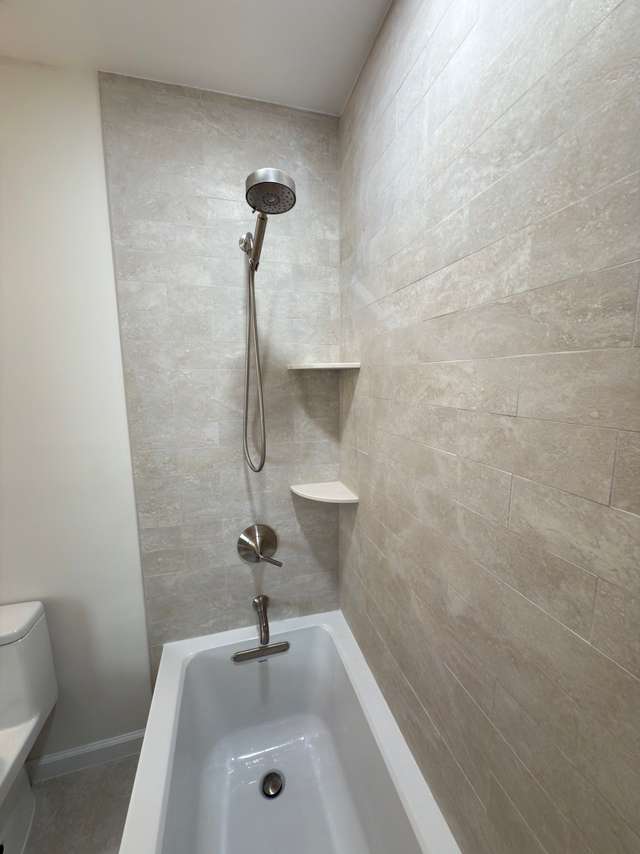 Bathroom Remodel using Tile by Home Concepts Construction