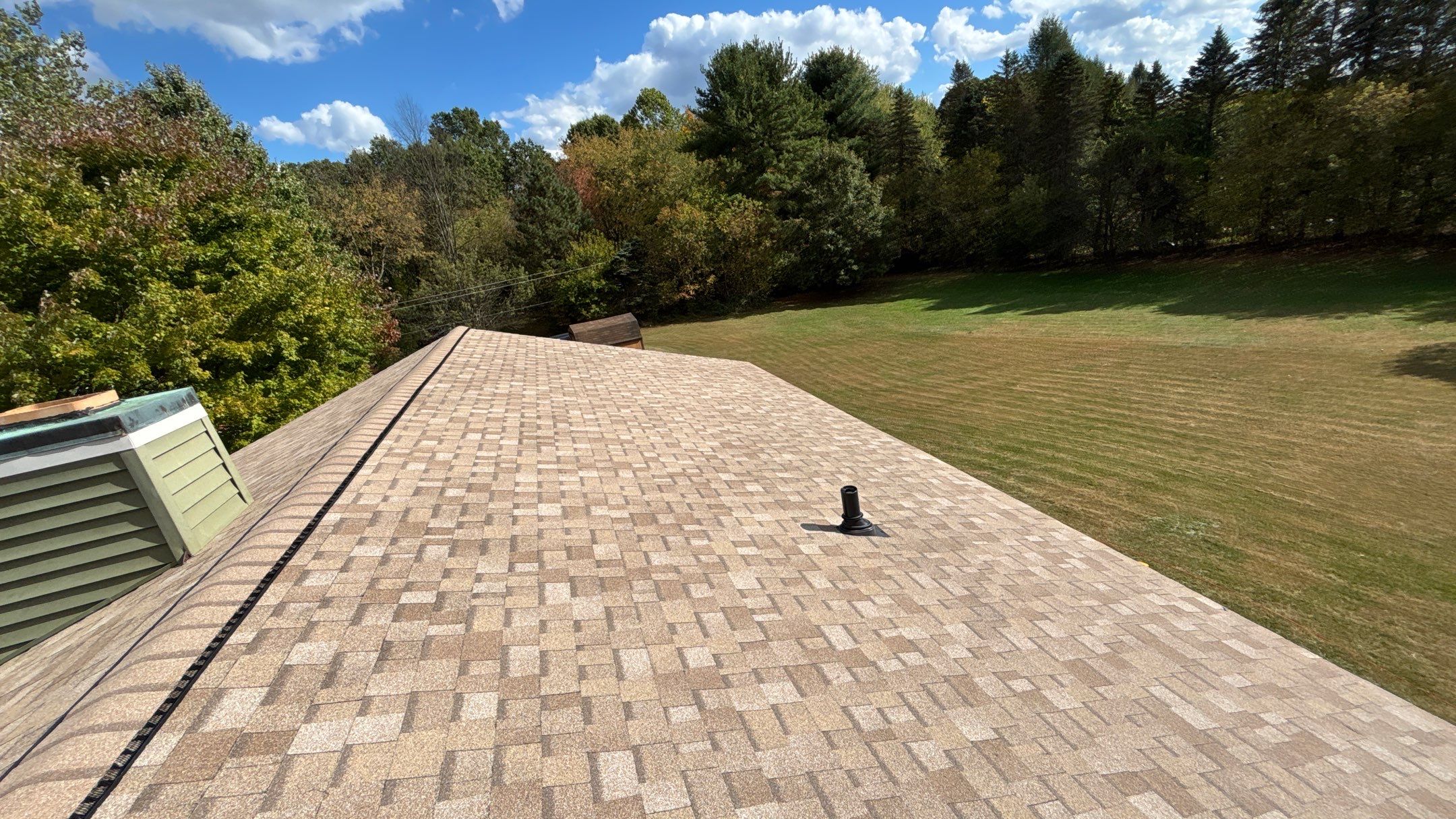 Roof Replacement using Owens Corning Sand Castle and Siding Replacement using Odyssey Plus D4" Wood Grain by 180 Contractors