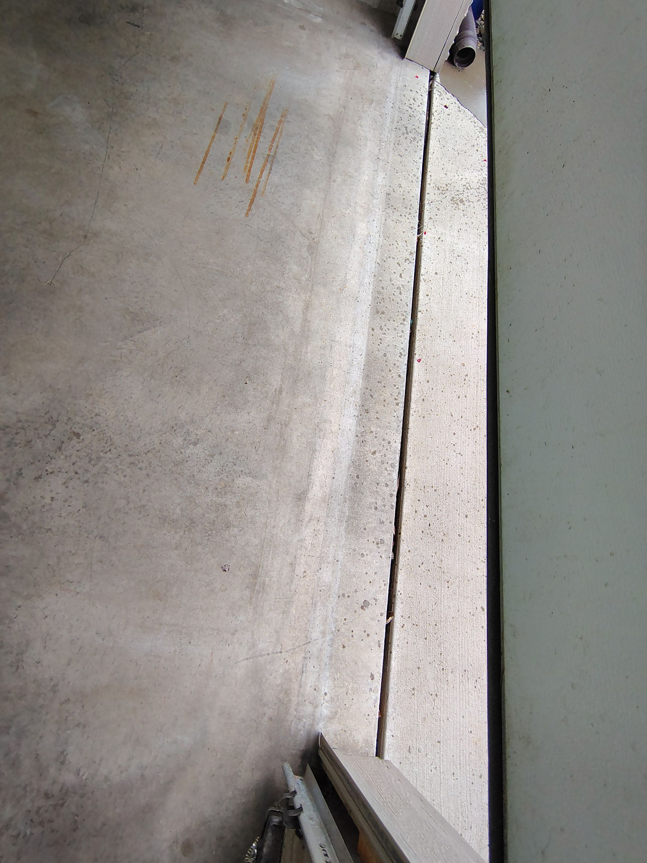 Multi-Car Garage Concrete Coating and Epoxy Finish in Sioux Falls by Select Painting, Coatings & Garage Cabinets
