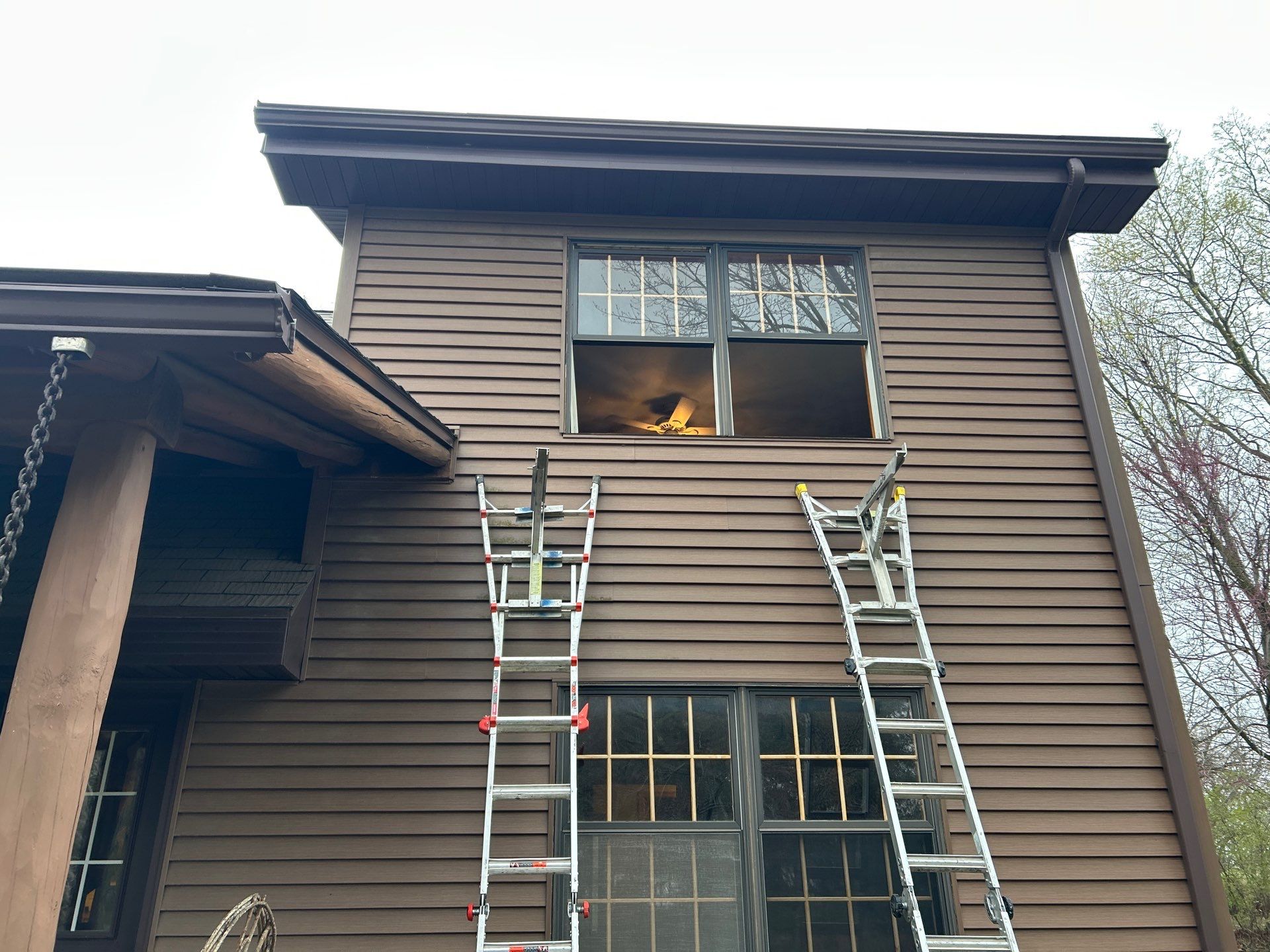 Pella Window installation using Pella Lifestyle wood/Aluminum window by United Windows and Siding LLC