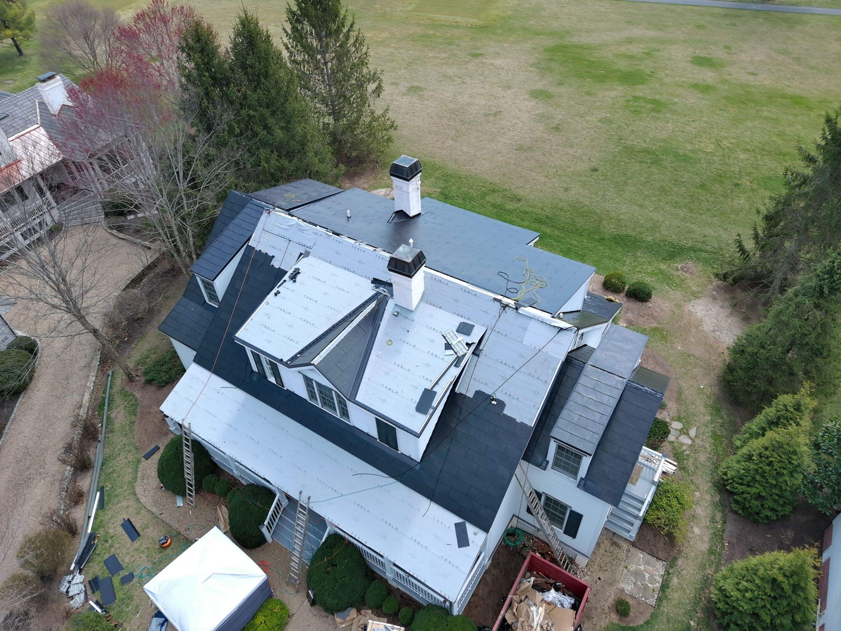 Tesla Solar Roof using Tesla Solar Roof by American Home Contractors