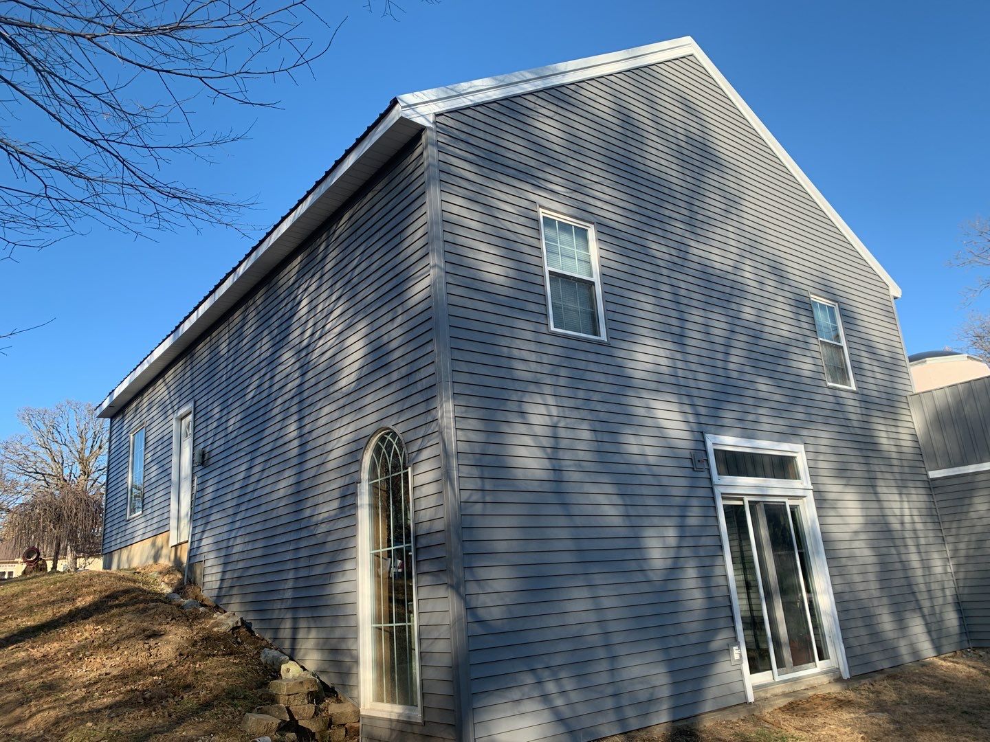 Contemporary house Siding Installation using Mastic Premium Vinyl siding  by EEC  Windows, Siding & Roofing 