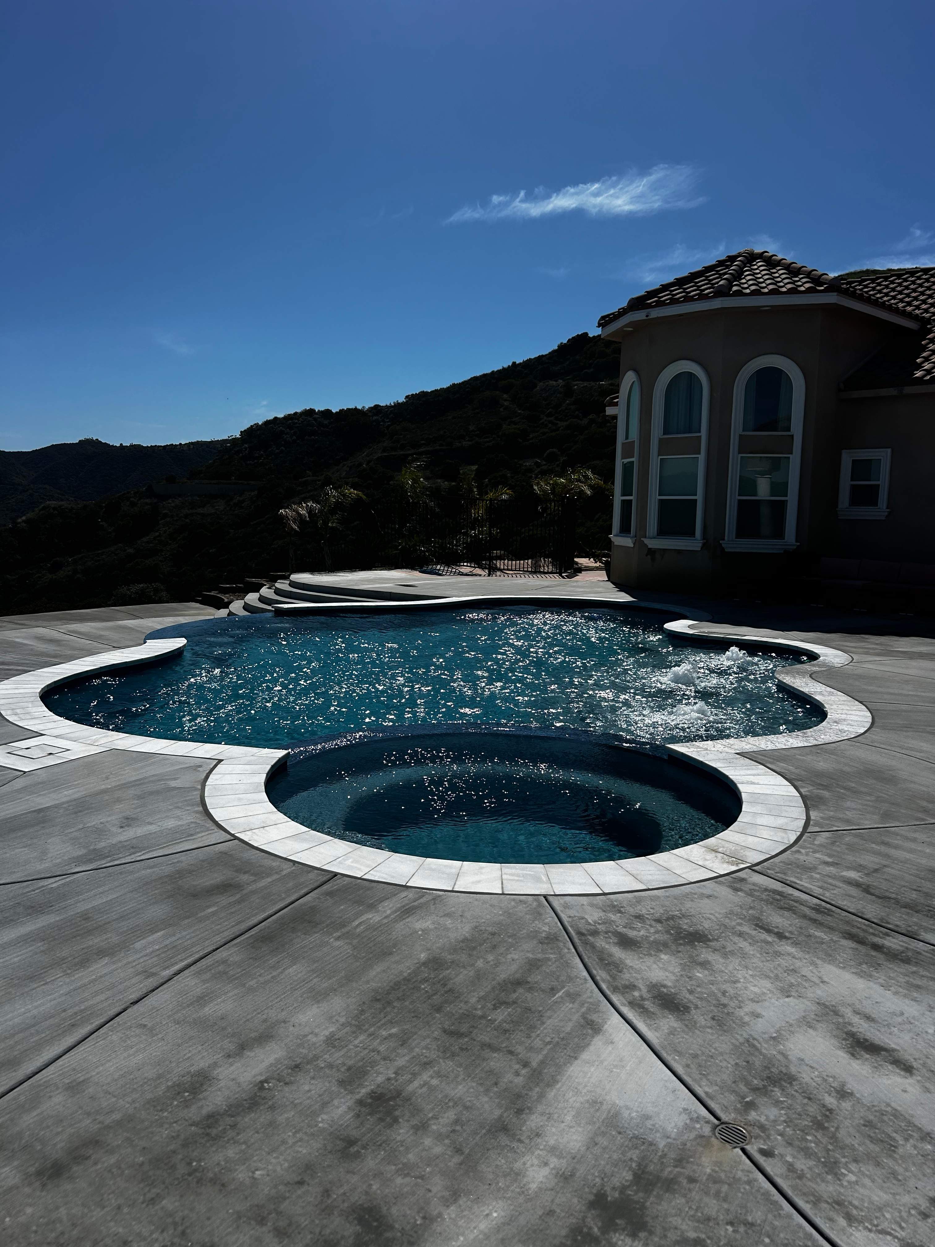 pool, spa, negative edge, bar stools by Premier Pools and Spas Temecula