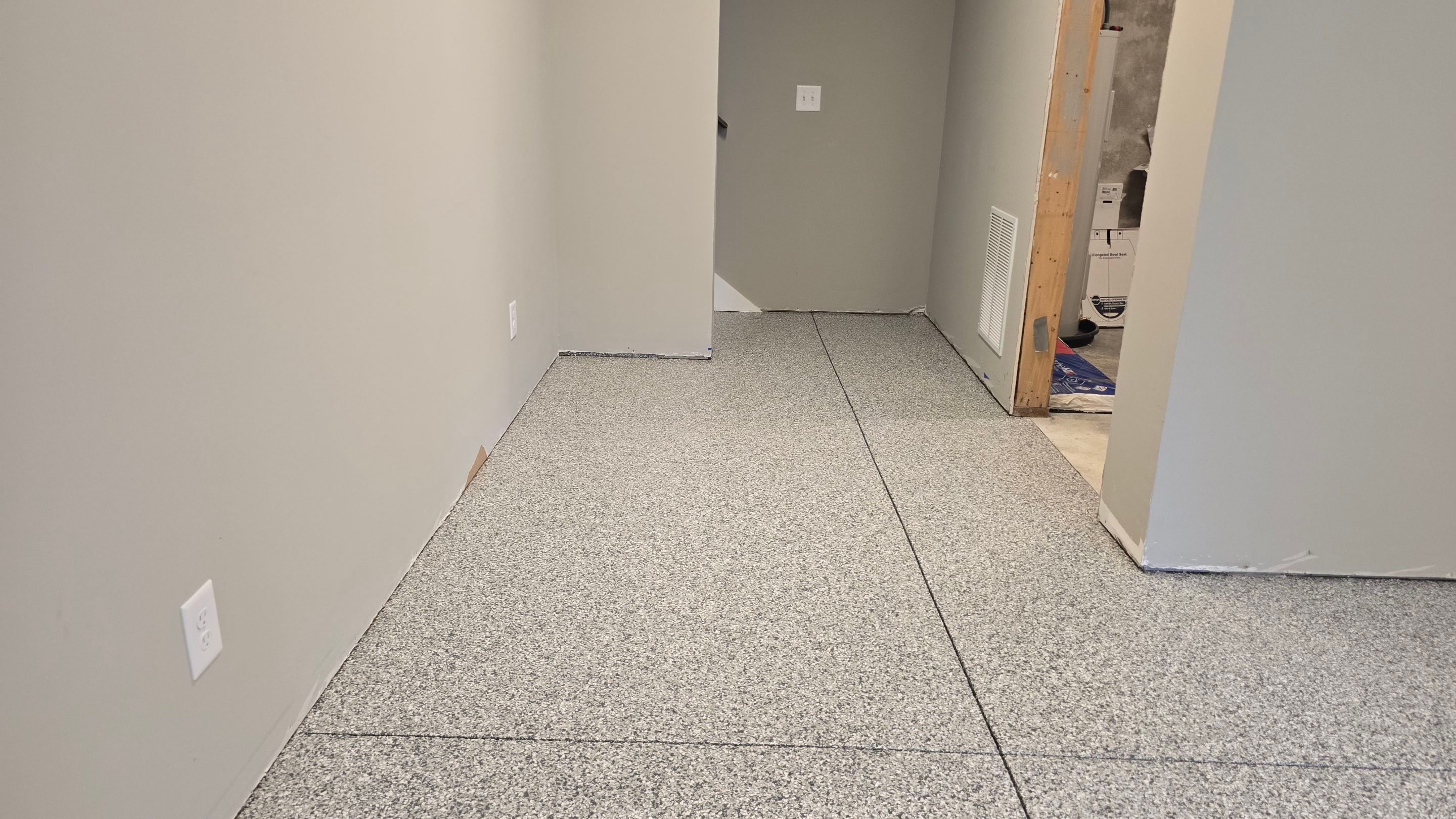 Patio Using Basalt & Garage Using Gravel by Elite Floor Solutions