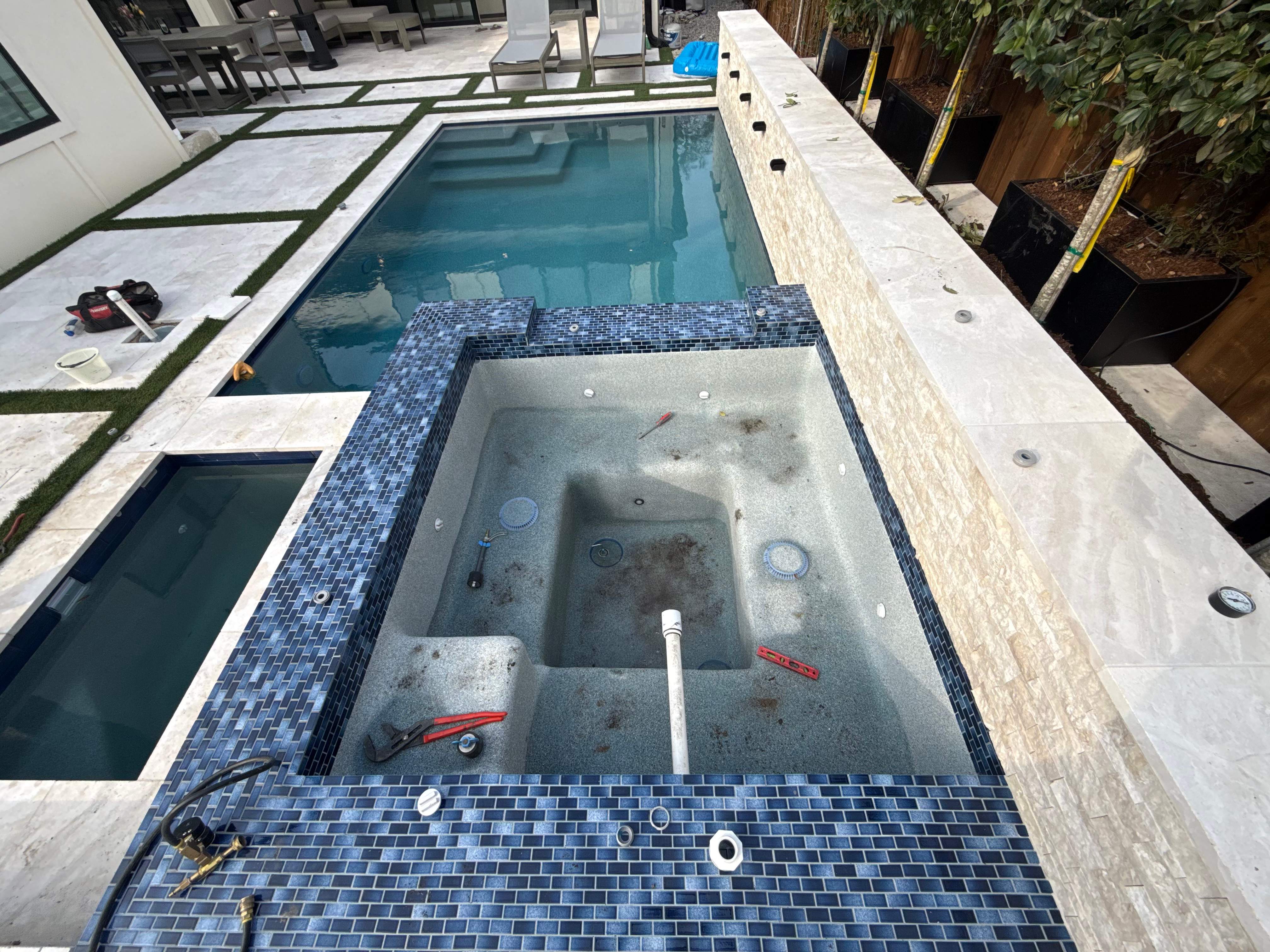 Modern Geometric Pool and Spa with Turf-Strip Decking by Pinnacle Pools and Spas - DFW