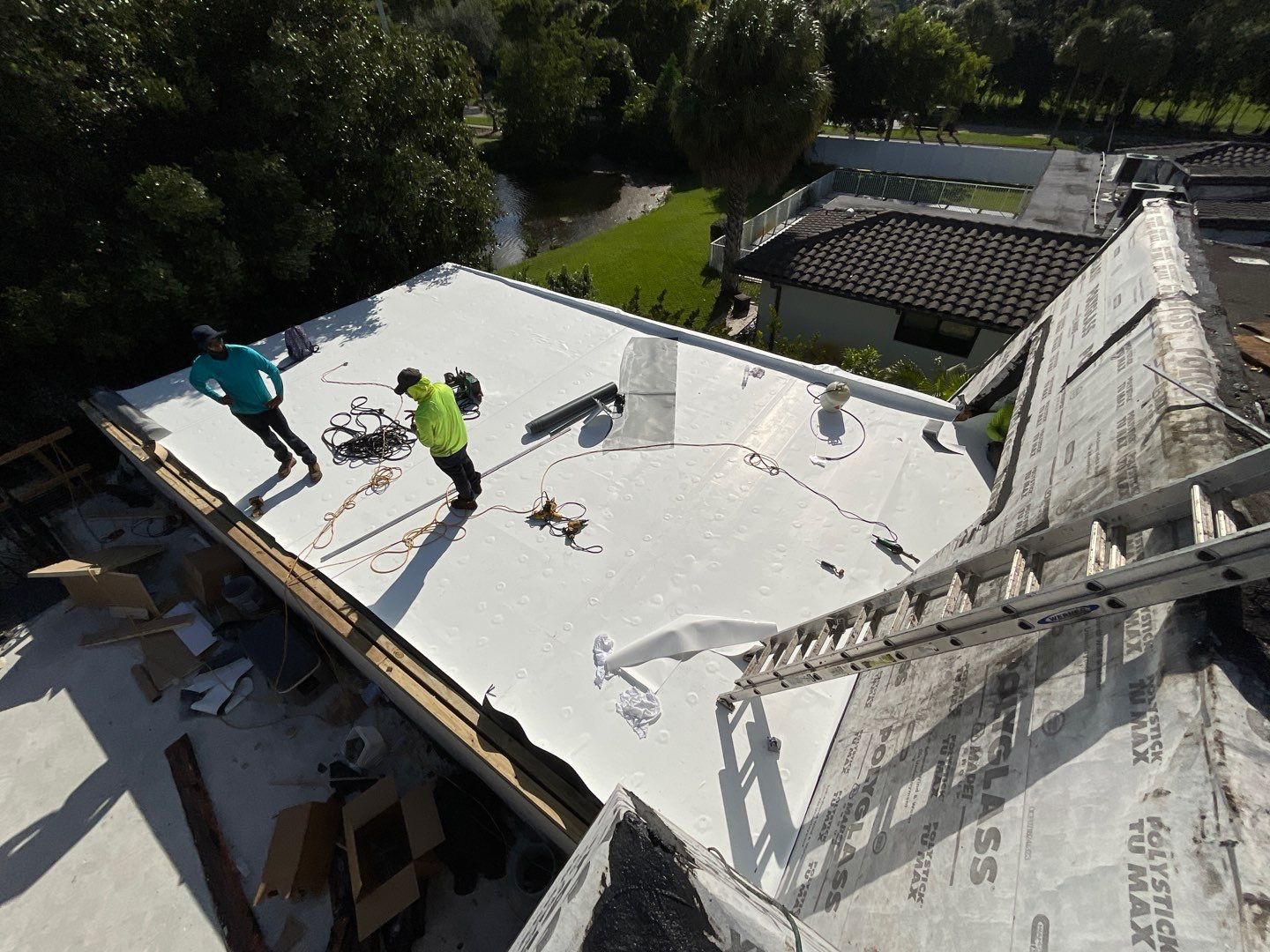 Amazing TPO flat deck re-roof with Eagle mansard in Hollywood Florida.  by First Due Roofing
