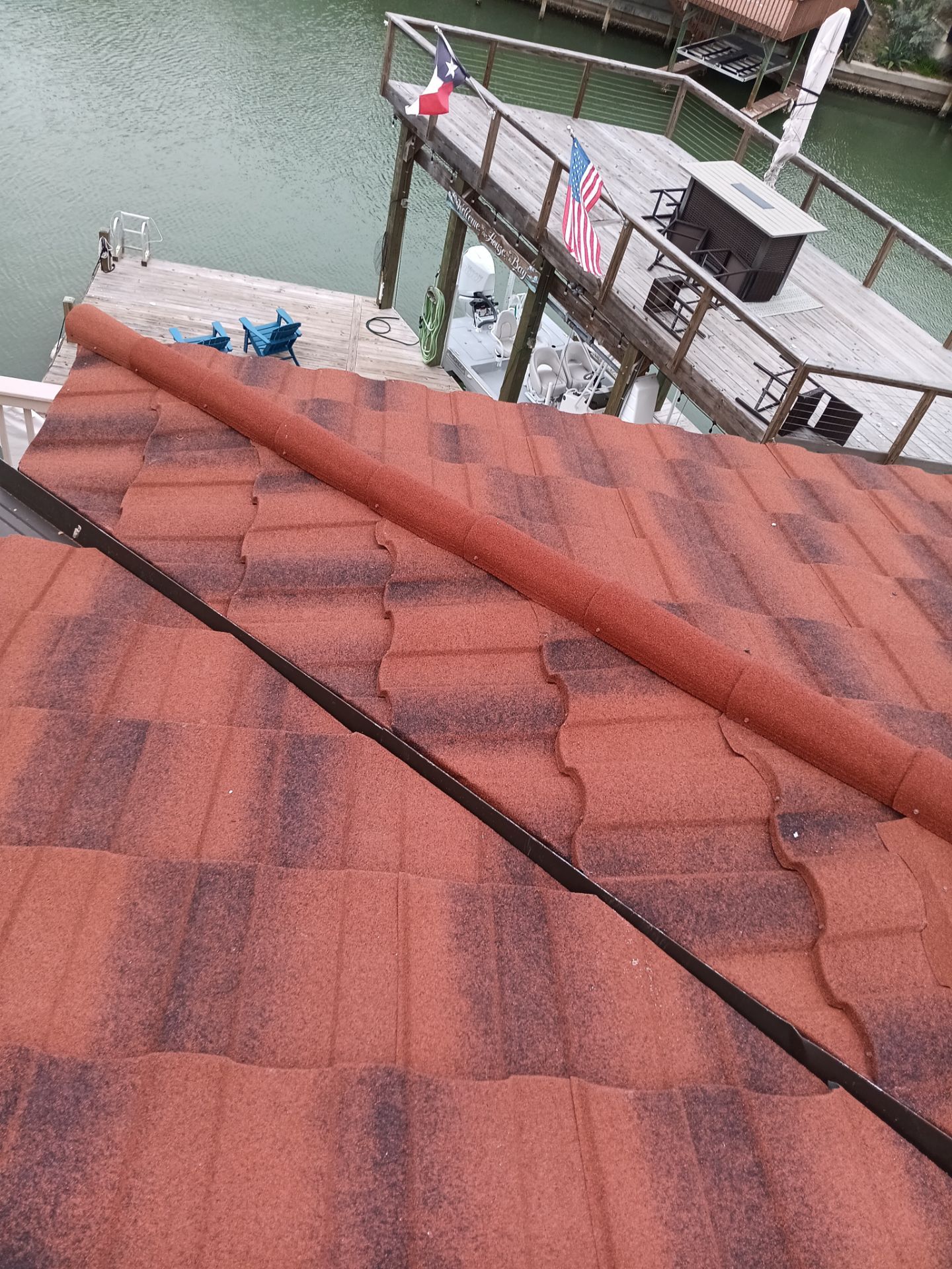 Off with the Tile and on with the TILCOR stone coated metal. by Bayfront Roofing and Construction
